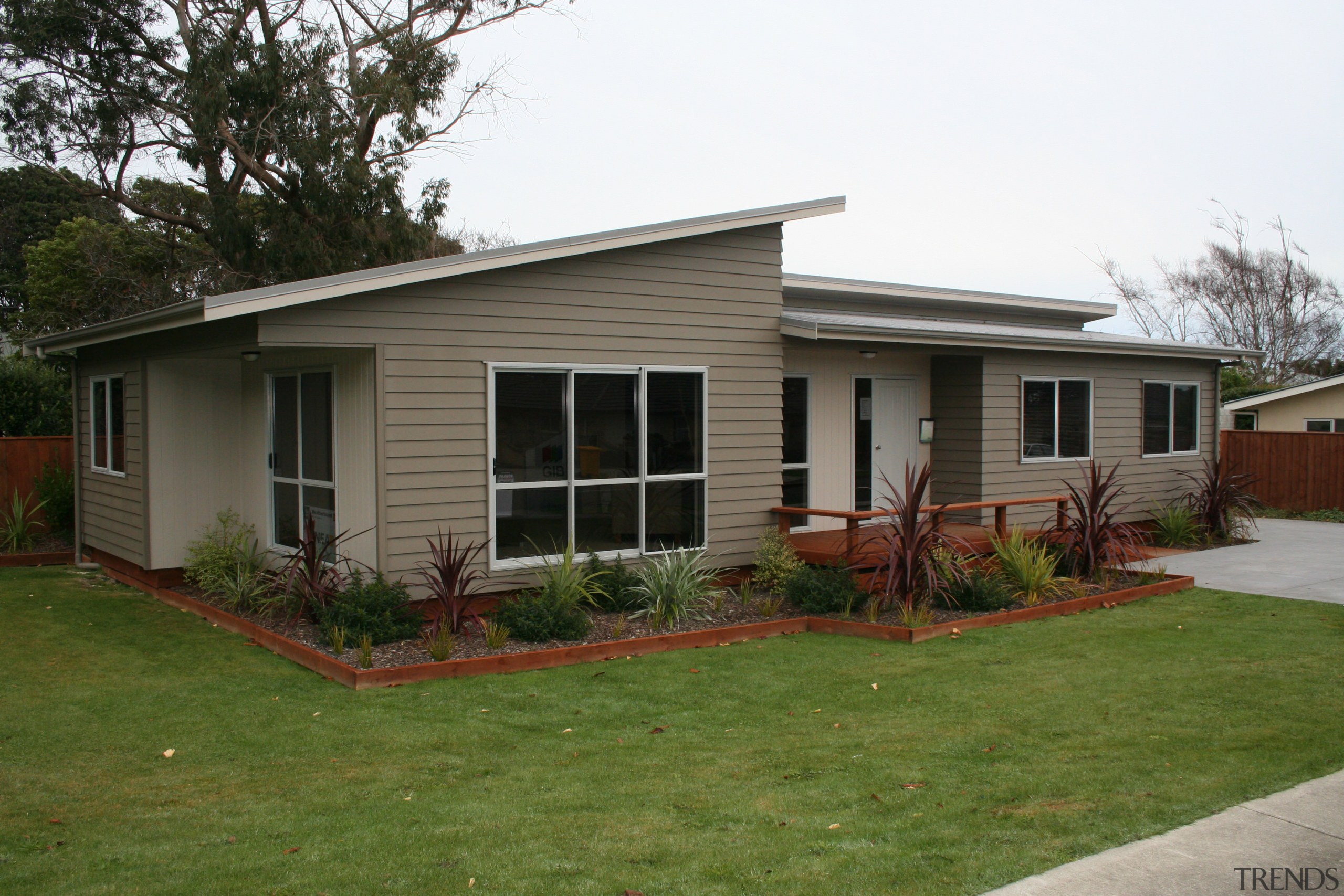 A1 Homes Beach Series house designed for coastal backyard, cottage, facade, farmhouse, grass, home, house, landscape, neighbourhood, property, real estate, residential area, roof, siding, window, yard, brown