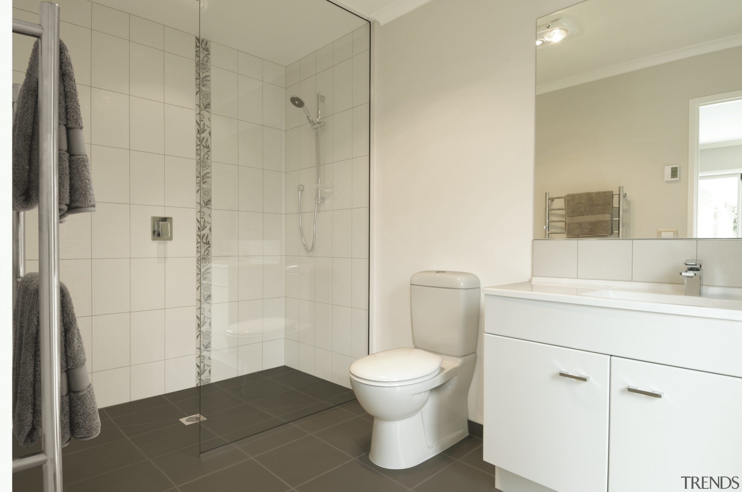 This show home was designed by Platinum Homes bathroom, bathroom accessory, bathroom cabinet, floor, home, interior design, product design, property, real estate, room, tile, gray