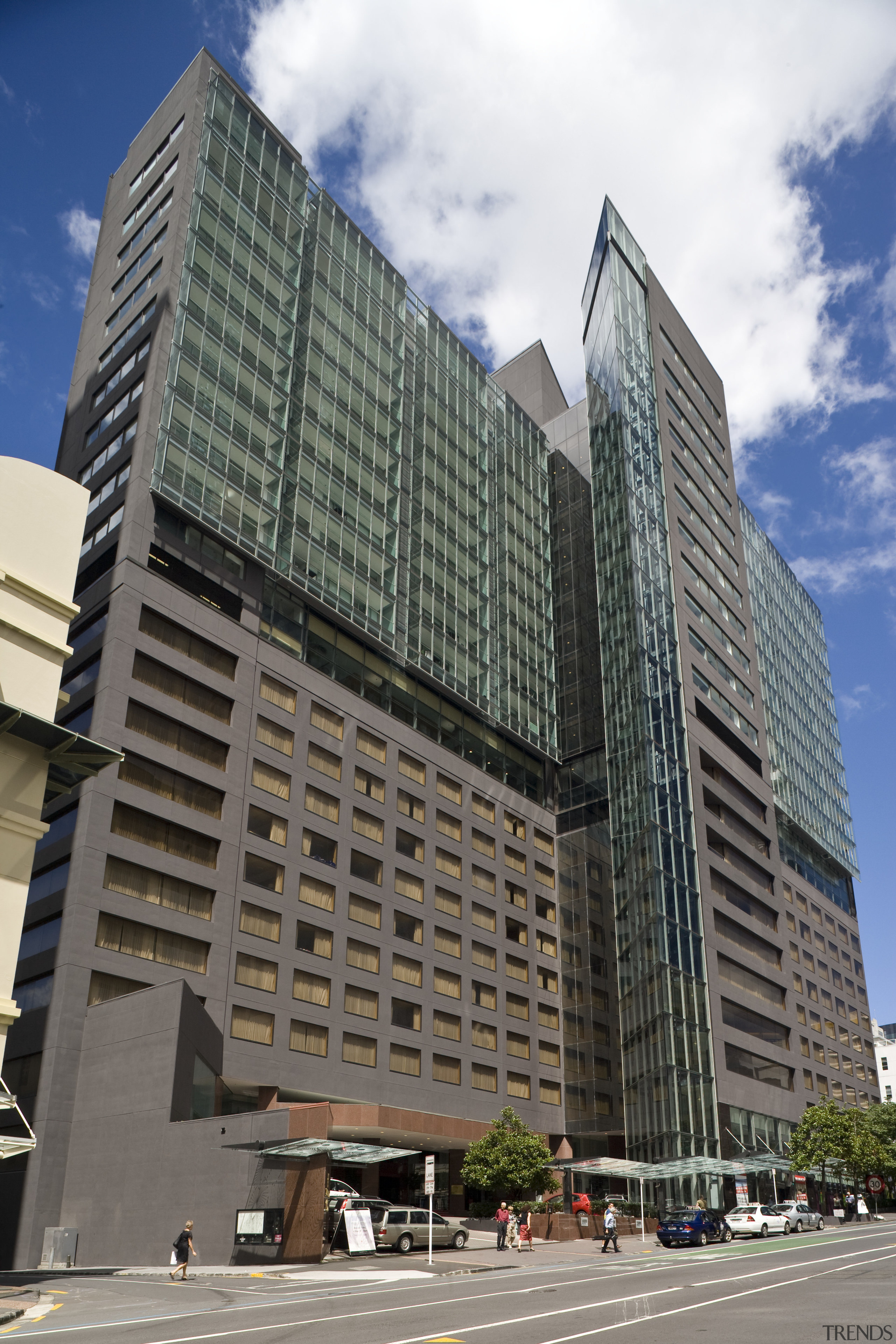 Exterior view of the apartments in Auckland CBD apartment, architecture, brutalist architecture, building, city, commercial building, condominium, corporate headquarters, daytime, downtown, facade, headquarters, hotel, landmark, metropolis, metropolitan area, mixed use, neighbourhood, residential area, sky, skyscraper, tower block, urban area, gray