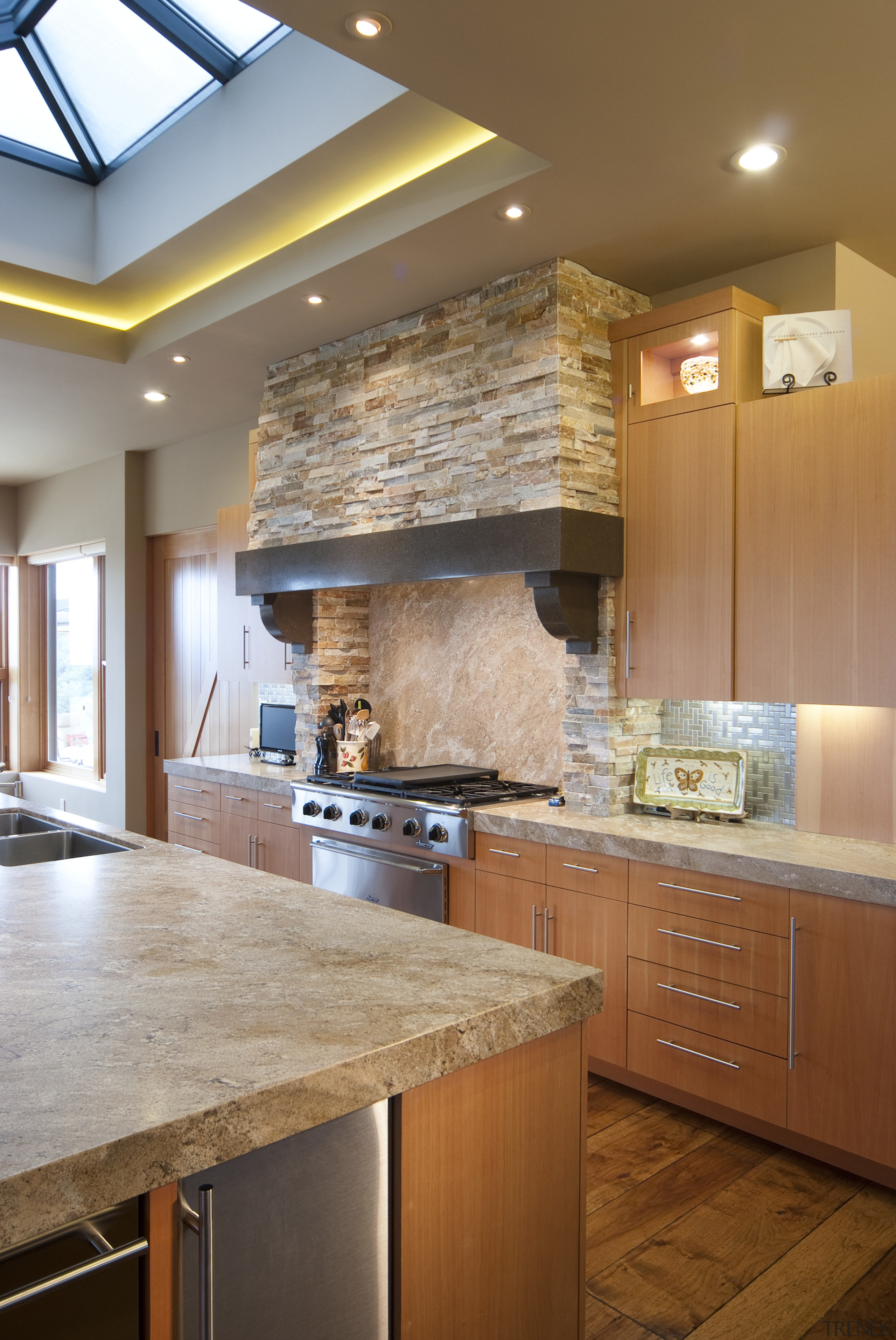 View of kitchen with wooden flooring, stone wall cabinetry, ceiling, countertop, cuisine classique, floor, flooring, hardwood, home, interior design, kitchen, room, under cabinet lighting, wood flooring, brown