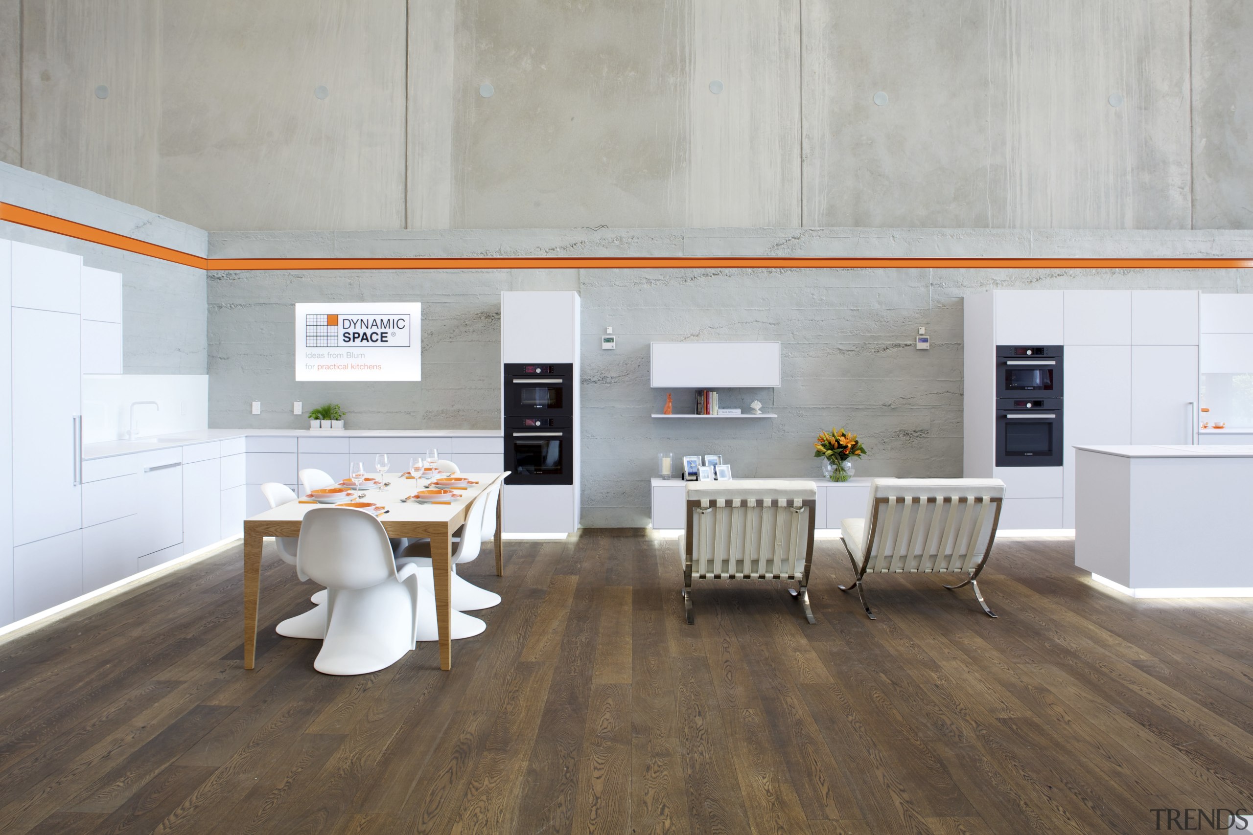 Showroom kitchen with wooden flooring and white kitchen ceiling, floor, flooring, interior design, laminate flooring, product design, table, wood, wood flooring, gray, white, brown