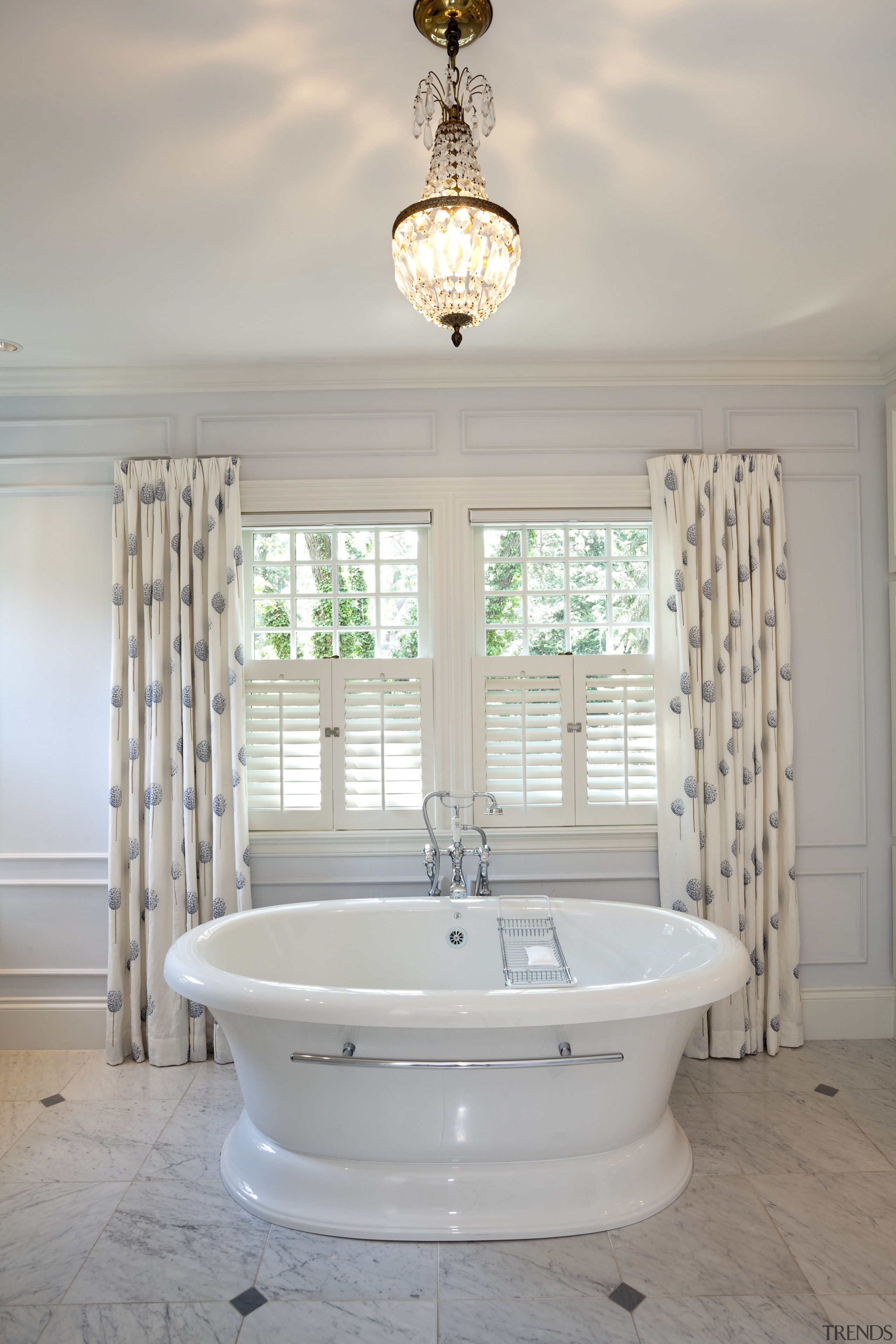 A bath view of a bathroom in white bathroom, bathtub, floor, home, interior design, plumbing fixture, room, sink, tap, window, gray