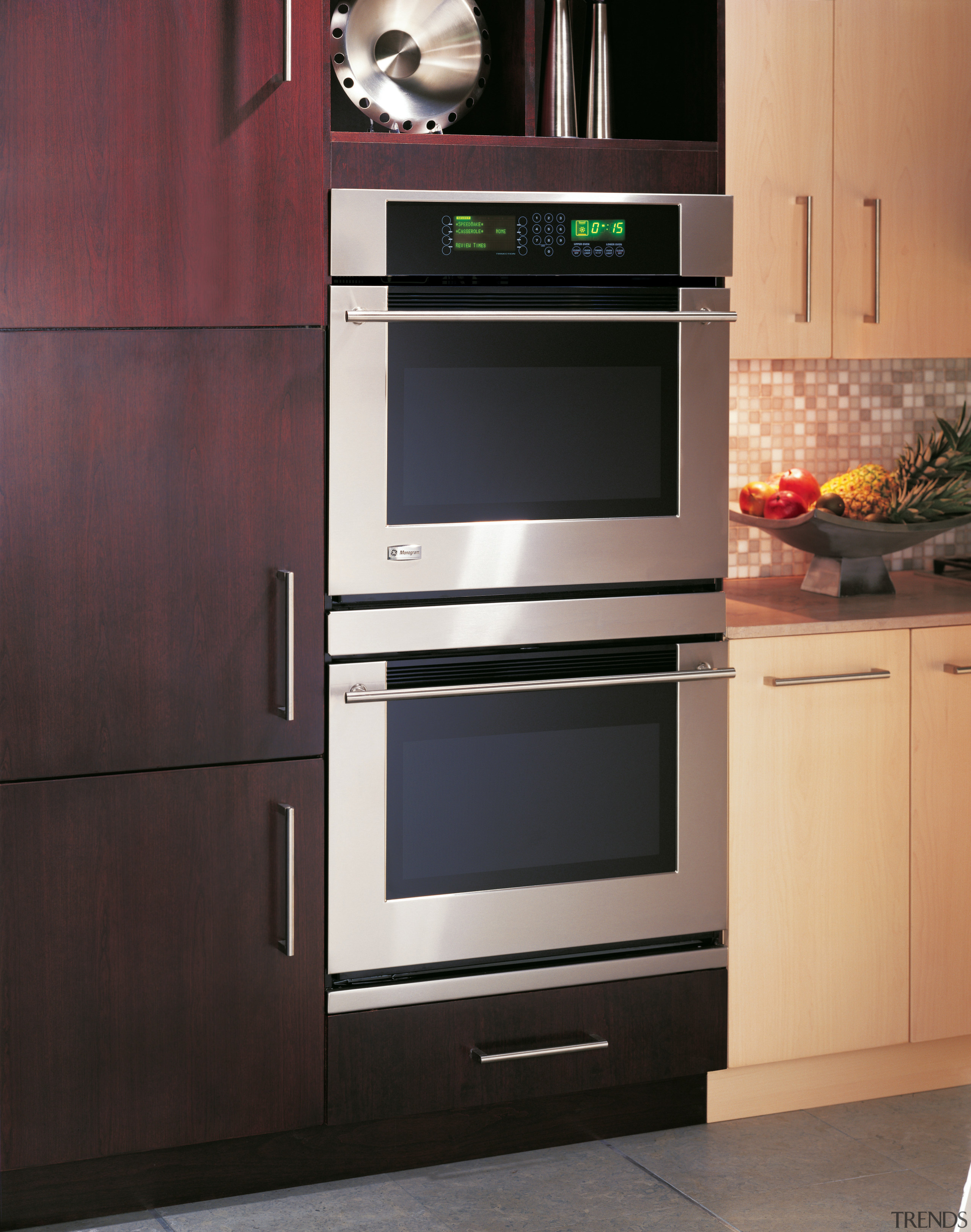 A view of a GE wall mounted oven. cabinetry, countertop, furniture, gas stove, home appliance, kitchen, kitchen appliance, kitchen stove, major appliance, microwave oven, oven, product, black