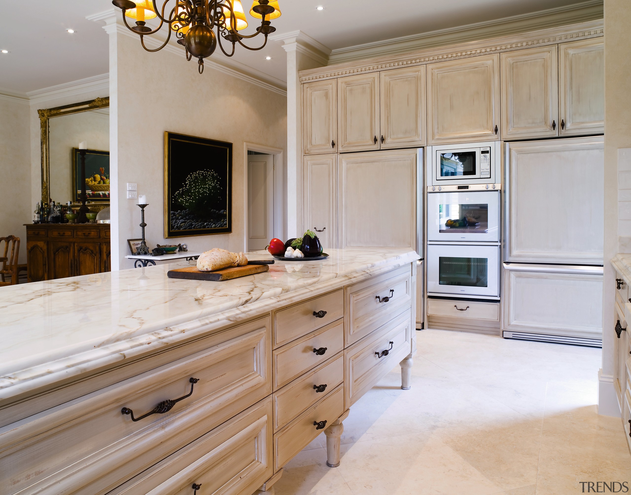 A view of the kitchen and dining areas, cabinetry, countertop, cuisine classique, floor, flooring, home, interior design, kitchen, room, wall, gray