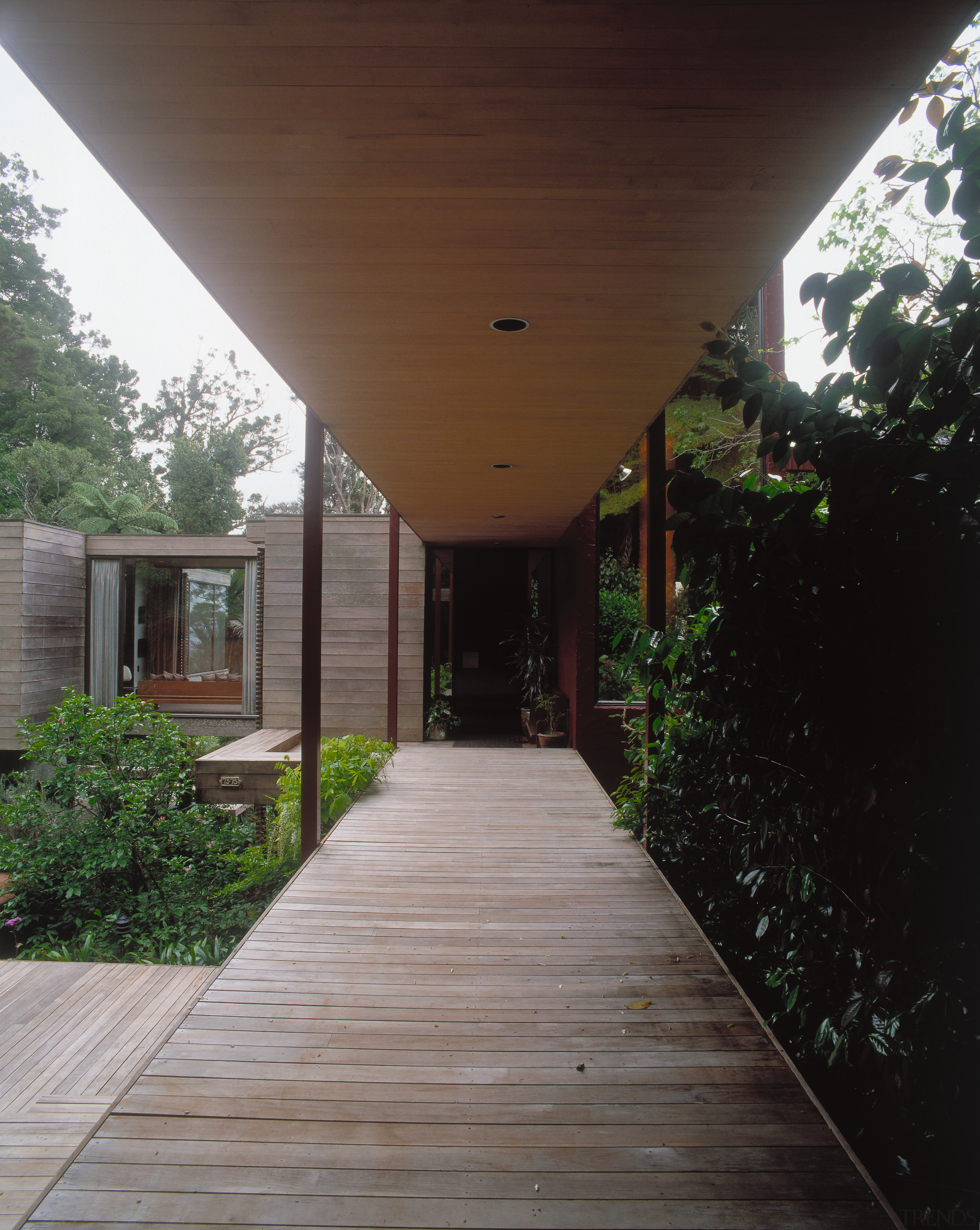 A view of this house designed by Ron architecture, backyard, deck, home, house, outdoor structure, porch, property, real estate, siding, walkway, wood, yard, black, gray