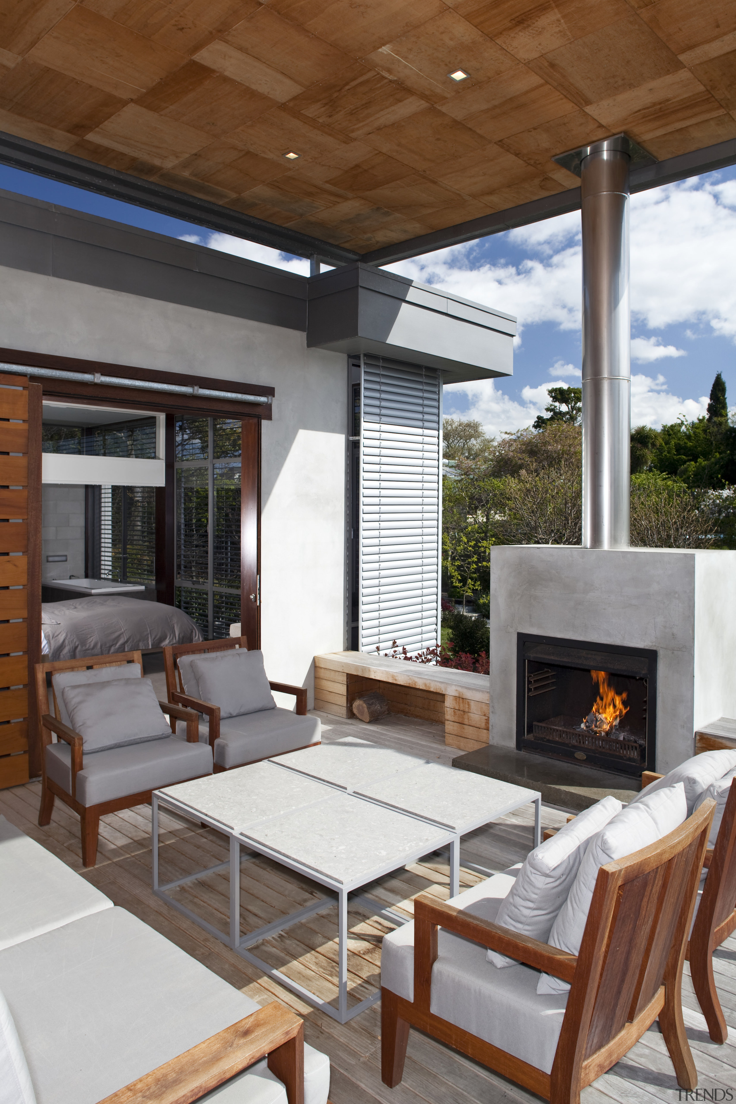 View of patio area which features outdoor chairs hearth, house, interior design, living room, outdoor structure, patio, real estate, table, brown, white