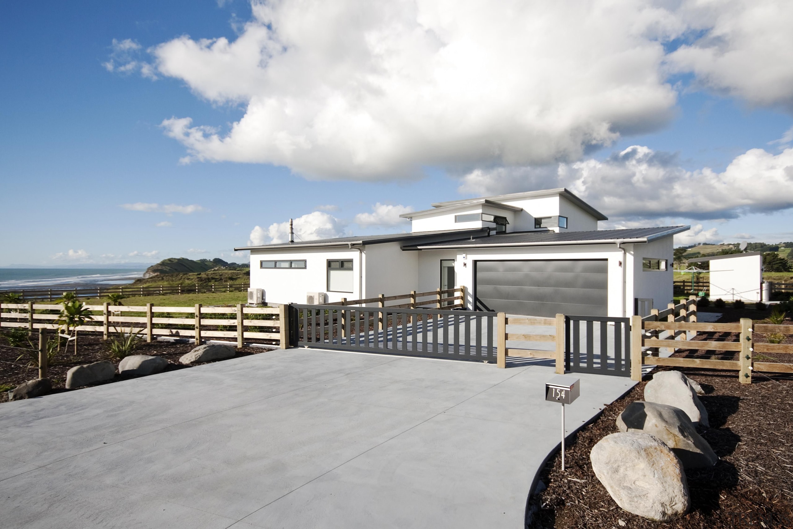 Built by Fowler Homes Taranaki in this stunning cloud, cottage, estate, home, house, property, real estate, sky, white, gray