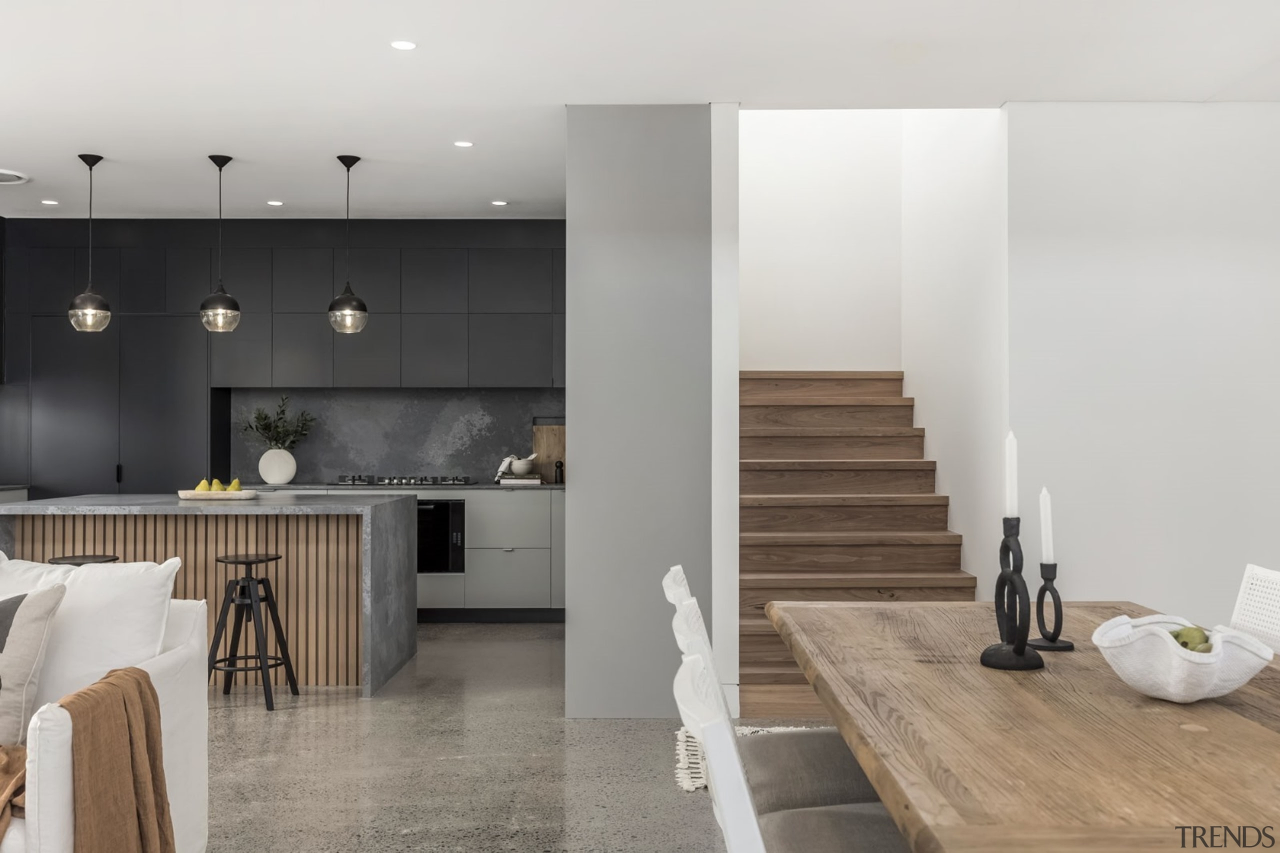 Kitchen, wood dining table and wood stair access 
