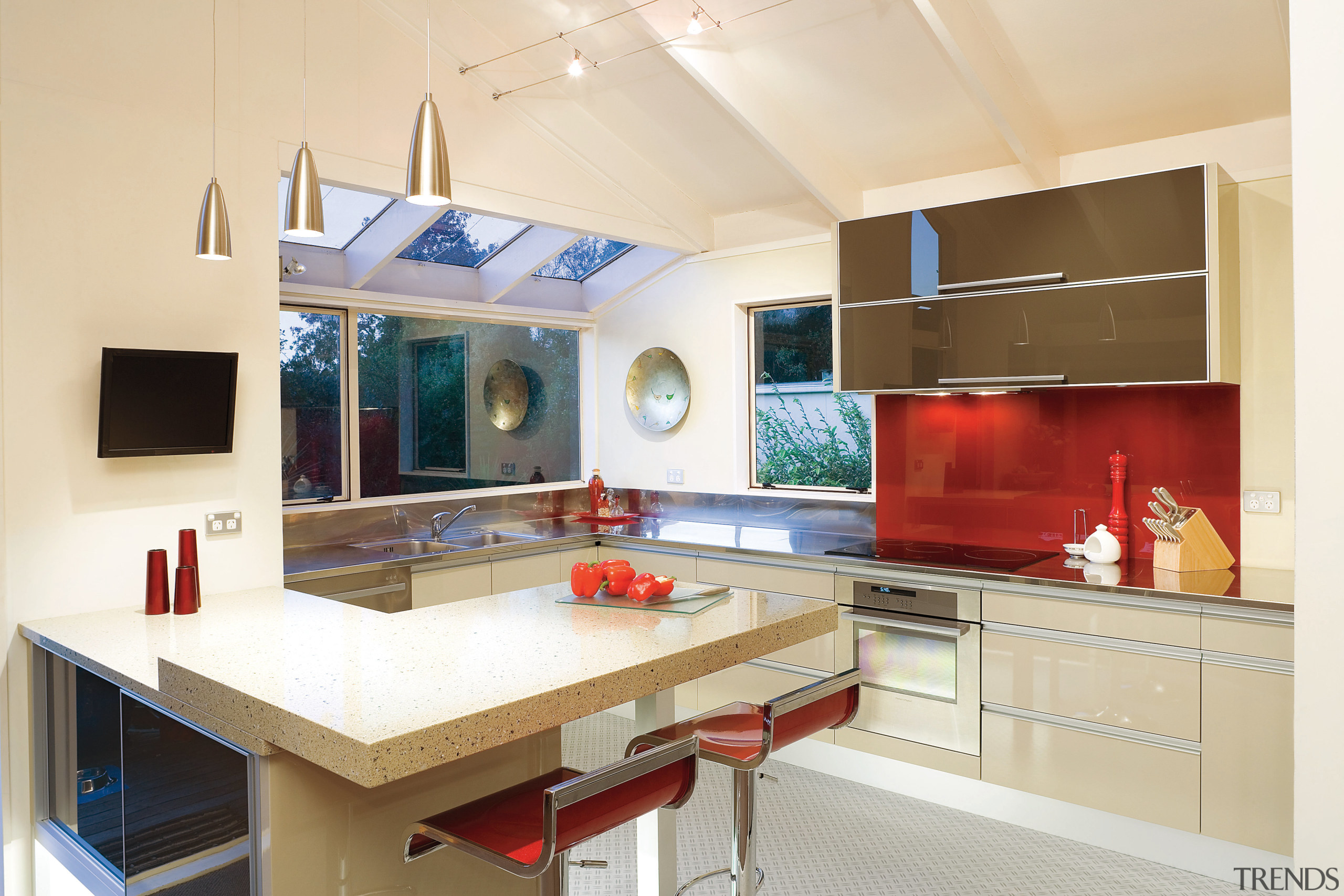 A view of this kitchen featuring quarell and countertop, cuisine classique, interior design, kitchen, real estate, room, orange