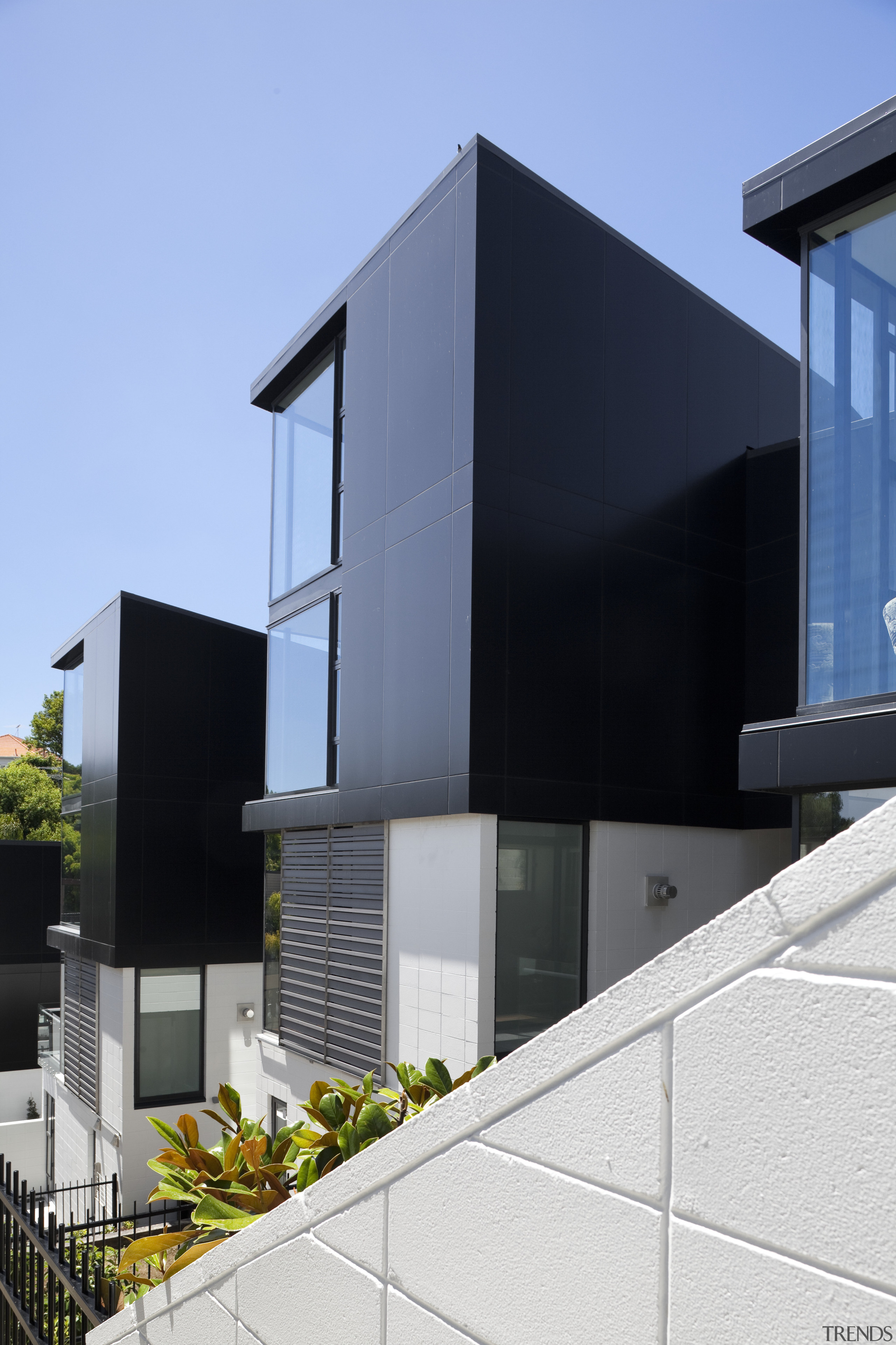View of three identical buildings with black exterior architecture, building, elevation, facade, glass, home, house, residential area, teal, black