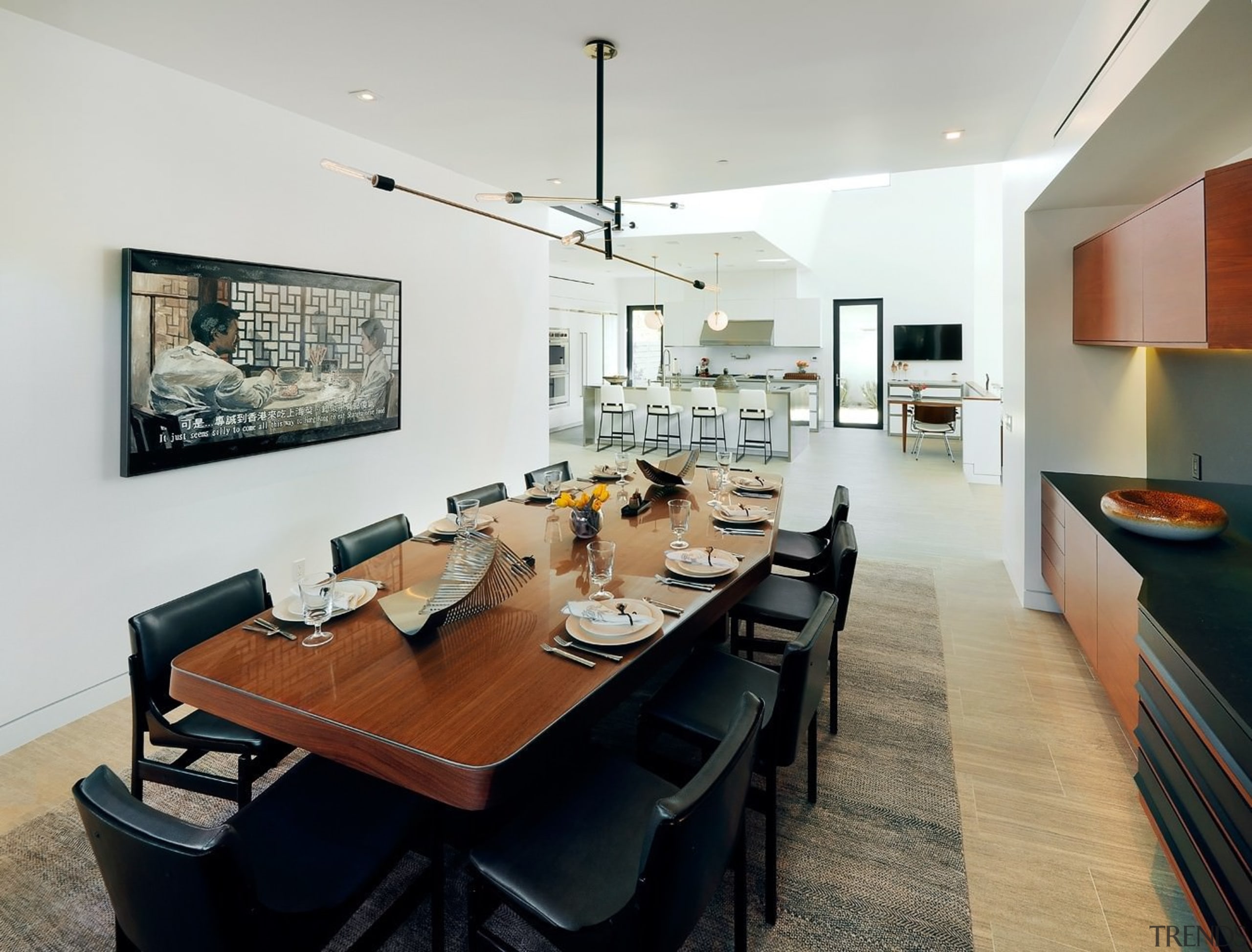 The dining area sits off to the side ceiling, dining room, interior design, living room, real estate, room, table, gray