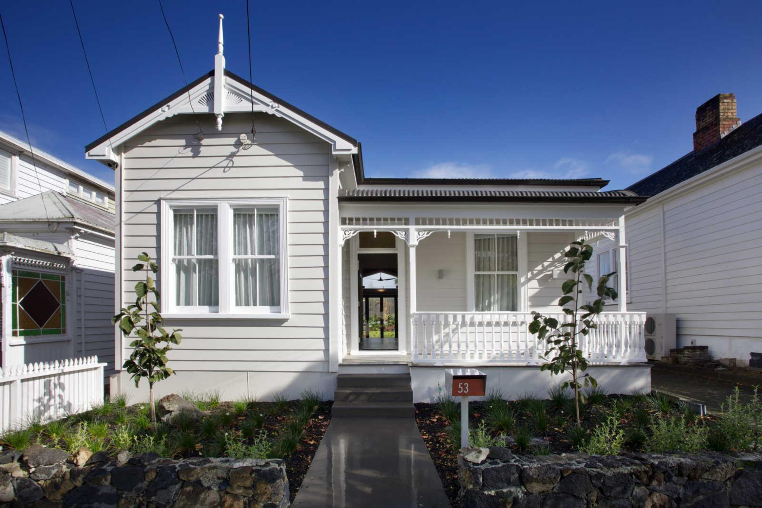 1.	The renovated villa retains its traditional character. building, cottage, estate, facade, home, house, neighbourhood, property, real estate, residential area, siding, window, blue