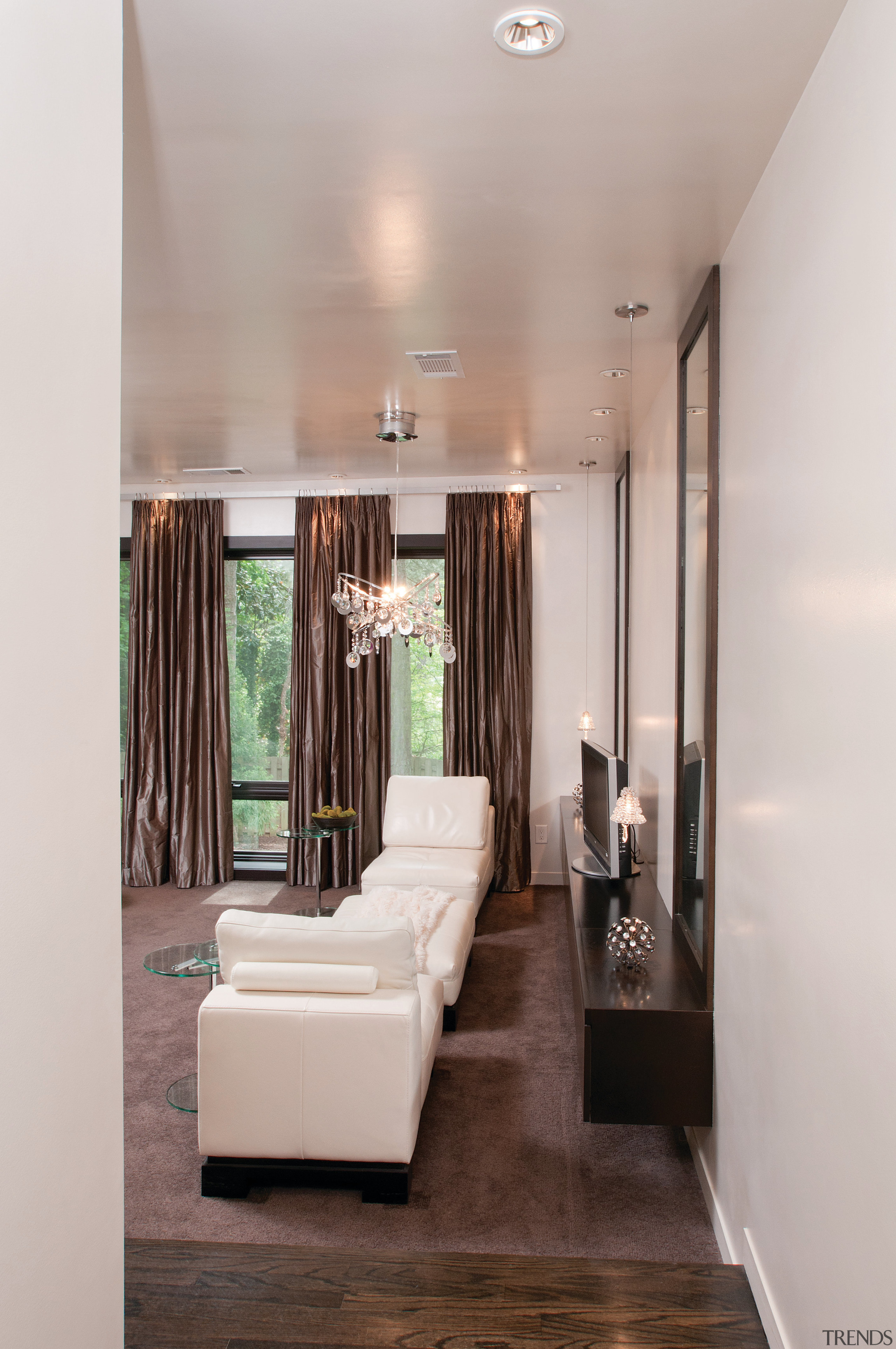 Taking a cue from contemporary luxury hotels, this ceiling, floor, flooring, home, interior design, living room, room, gray