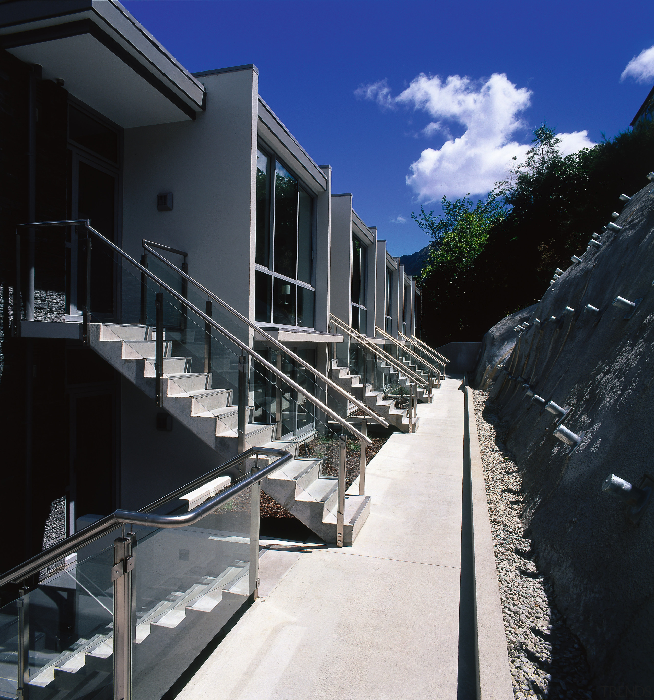 Row of apartments with balconies and steps leading apartment, architecture, building, condominium, facade, handrail, house, real estate, residential area, sky, black