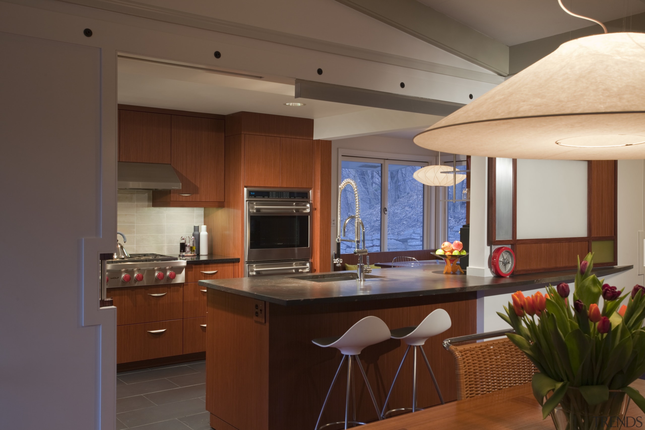 wooden cabinetry, island incorporates bar seating, integrated wall cabinetry, countertop, cuisine classique, interior design, kitchen, real estate, room, brown