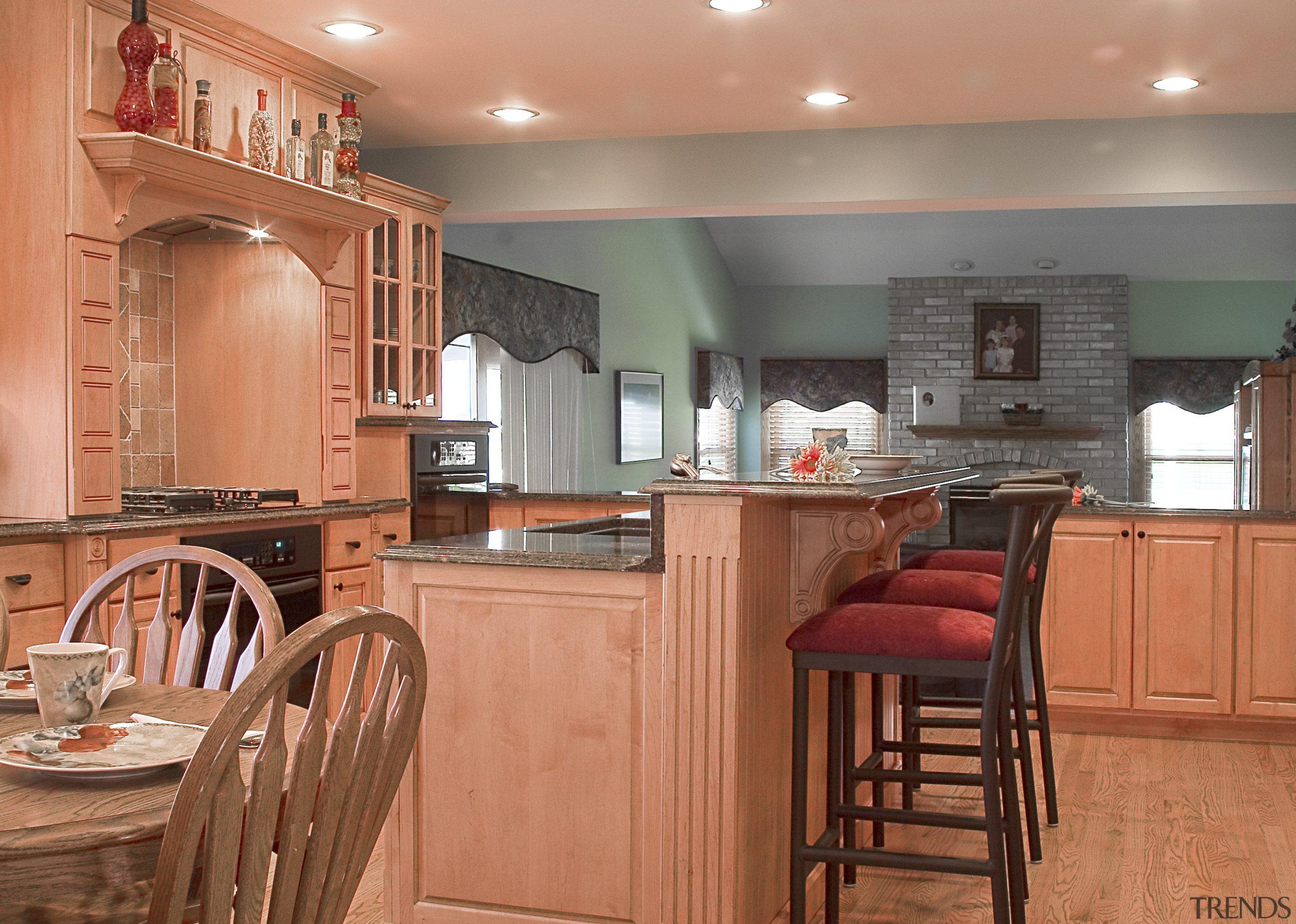 A view of this kitchen designed by Designer cabinetry, countertop, cuisine classique, floor, flooring, hardwood, home, interior design, kitchen, real estate, room, wood, wood flooring, orange