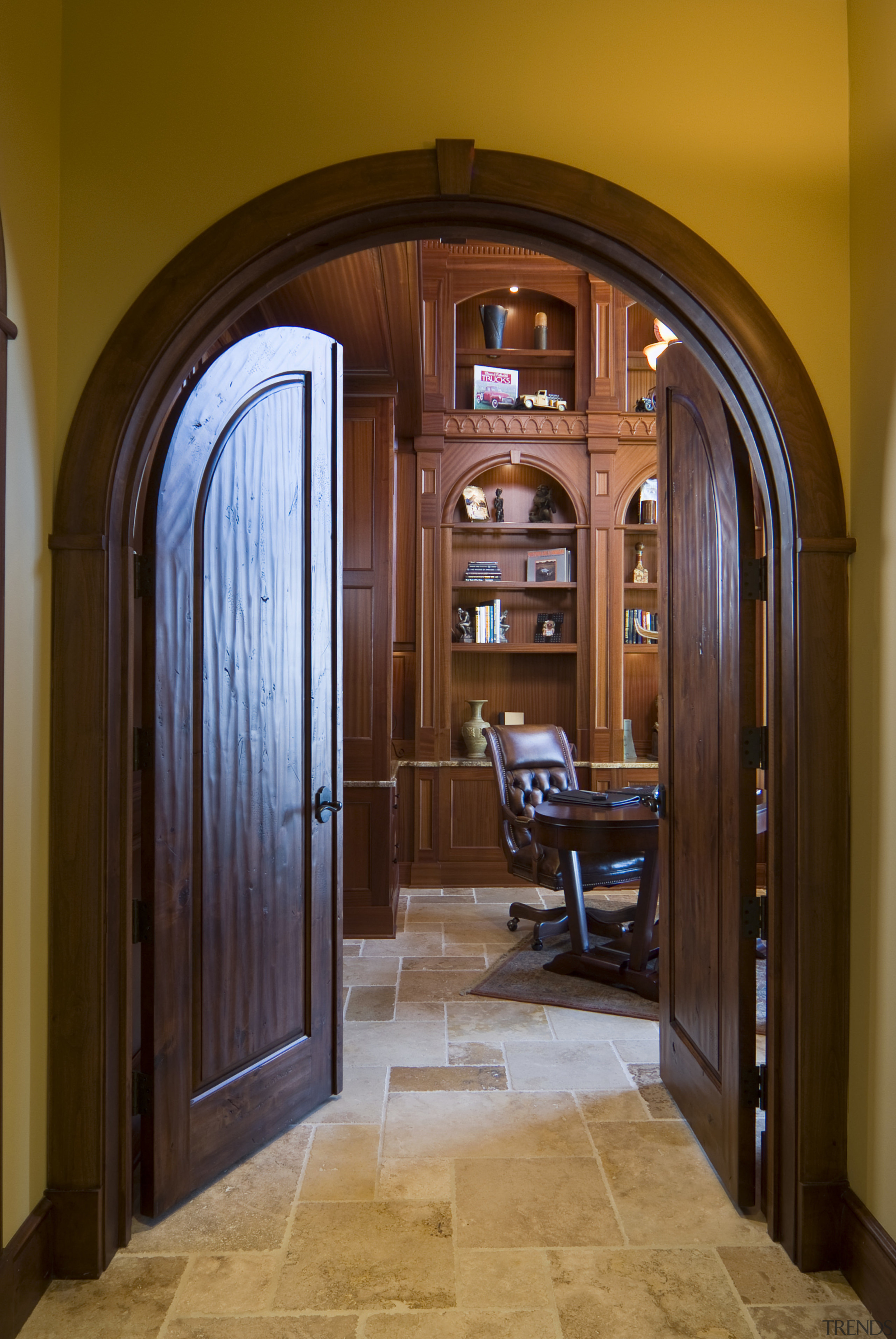 Image of the interior designed by Pacific Crest. arch, architecture, cabinetry, door, estate, hardwood, home, interior design, window, wood, brown