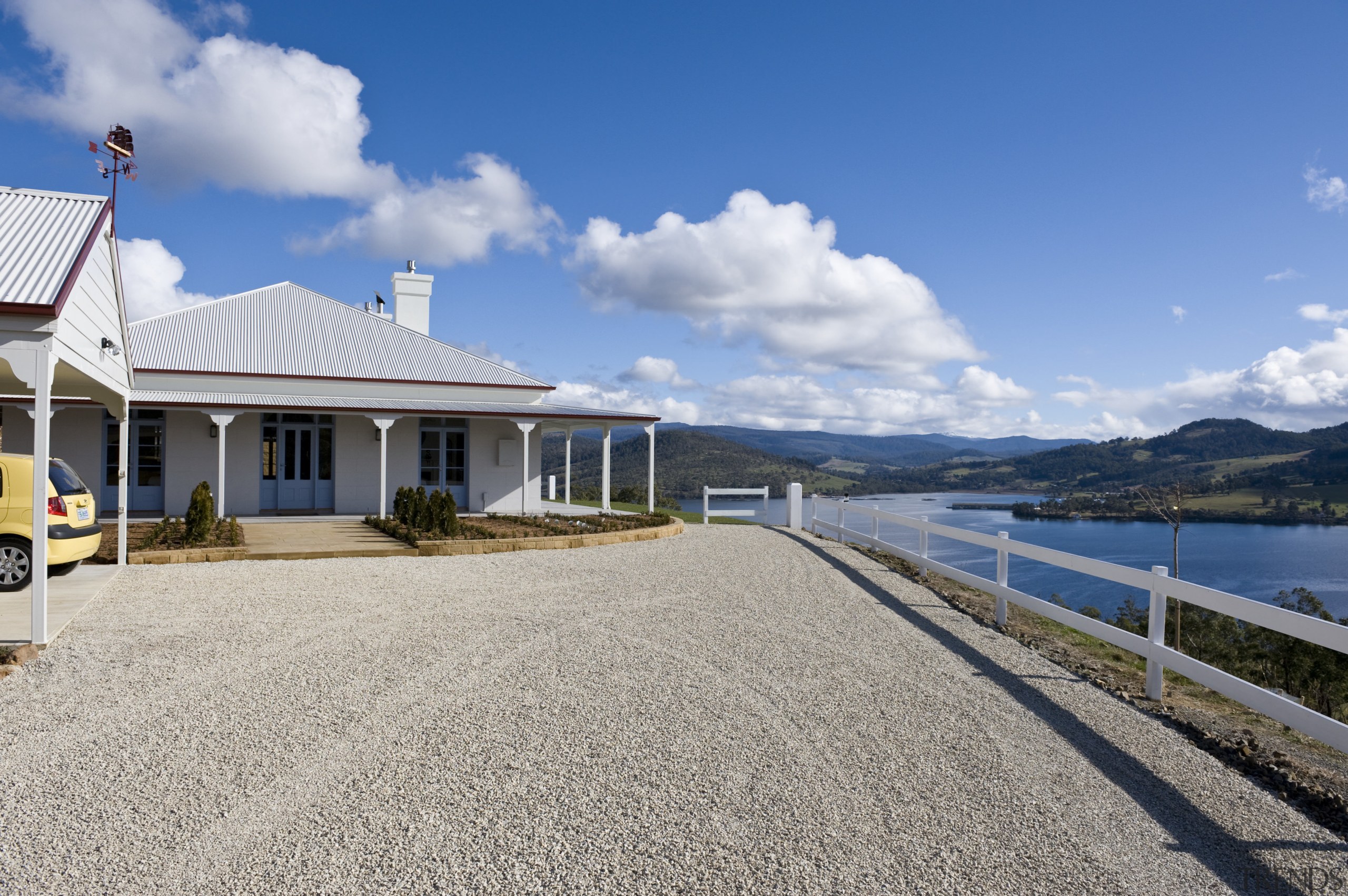 Exterior view of Victorian-syle house featuring steel roofing, cloud, coast, cottage, estate, home, house, mountain, property, real estate, sky, villa, water, gray