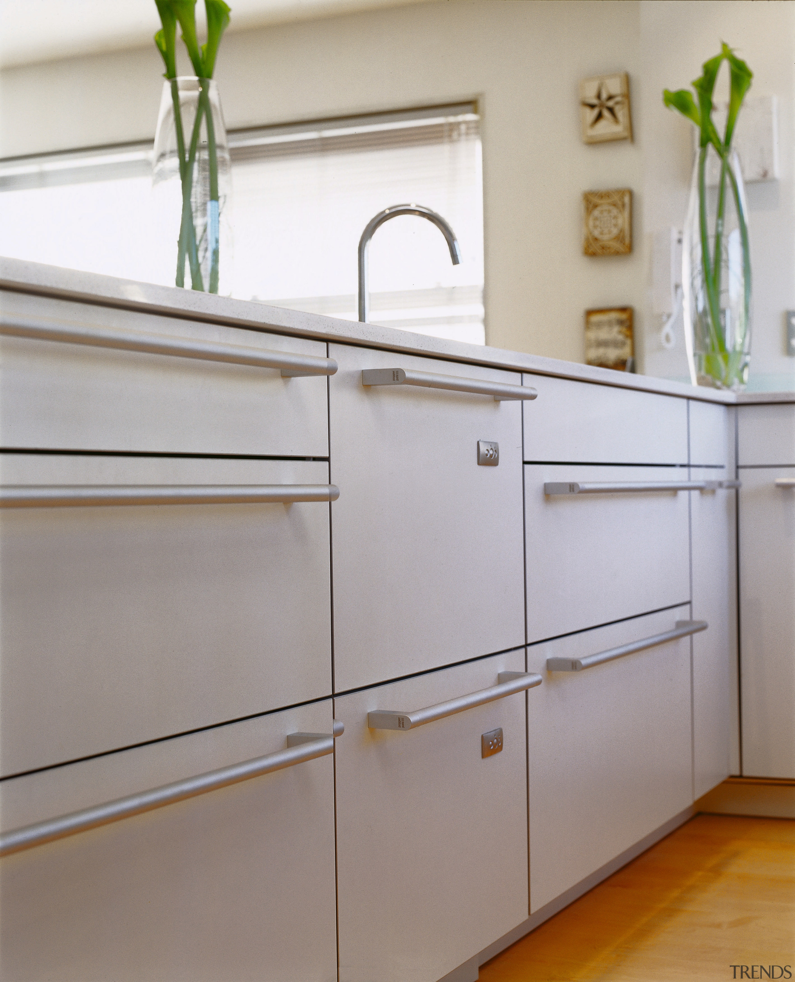 Kitchen with cream cabinetry and stainless handles, with cabinetry, chest of drawers, countertop, drawer, furniture, home appliance, kitchen, major appliance, product, product design, sideboard, gray