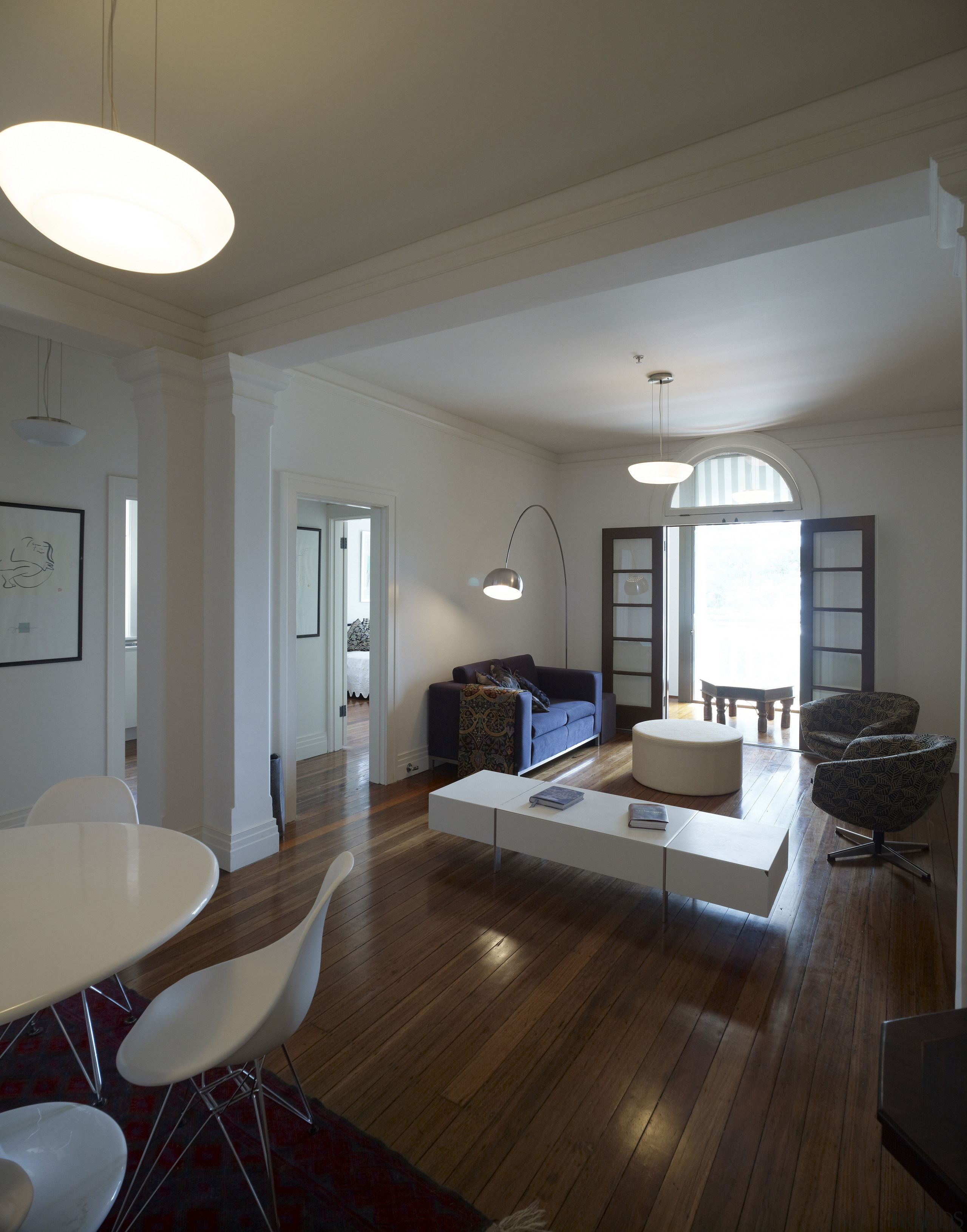 View of apartment living area in a restored apartment, architecture, ceiling, daylighting, floor, flooring, hardwood, home, house, interior design, laminate flooring, living room, real estate, room, table, window, wood, wood flooring, gray, brown