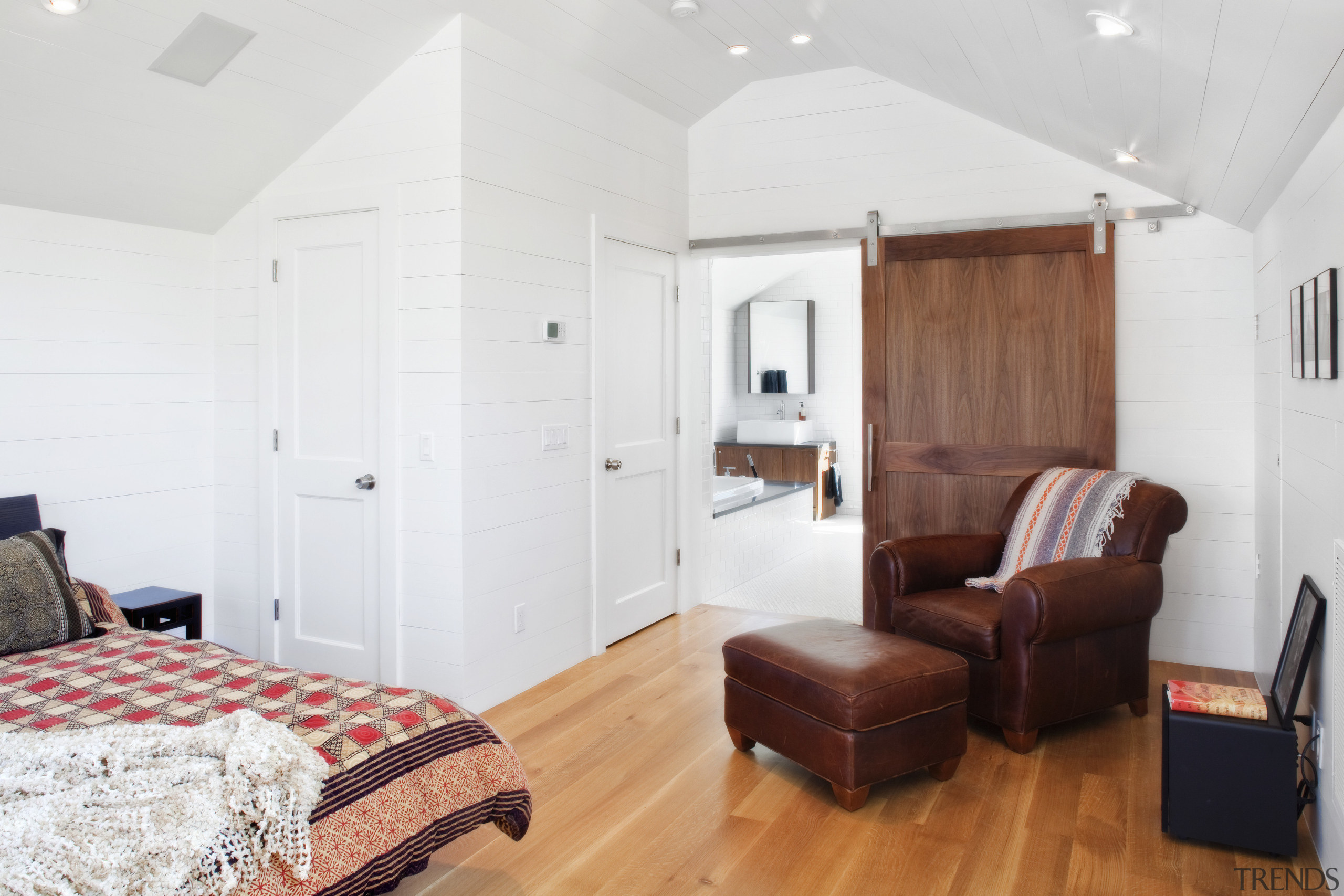View of bedroom with wooden flooring and brown bedroom, ceiling, floor, flooring, home, interior design, property, real estate, room, suite, wall, wood, wood flooring, white