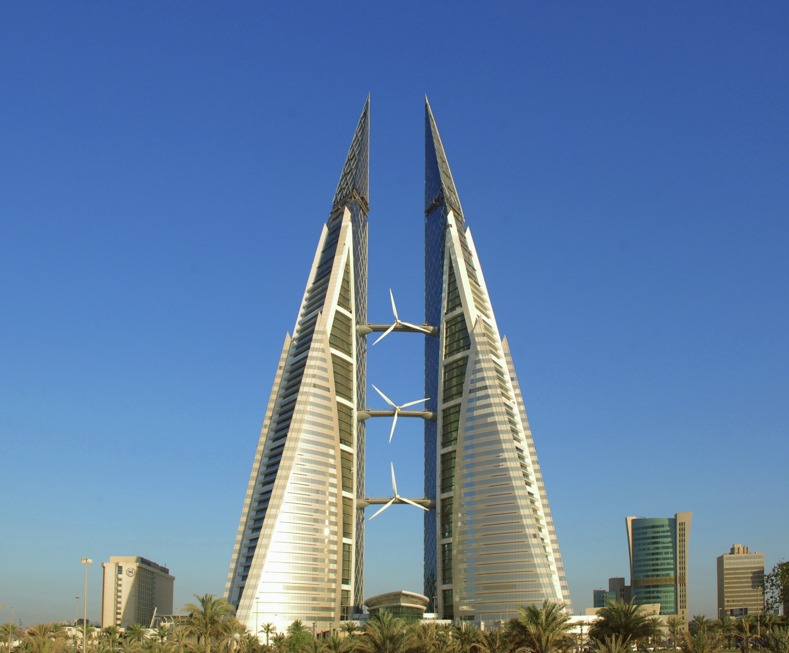 The new Bahrain world Trade Centre meets up building, corporate headquarters, daytime, fixed link, landmark, metropolis, metropolitan area, national historic landmark, sky, skyscraper, spire, tower, tower block, blue, teal