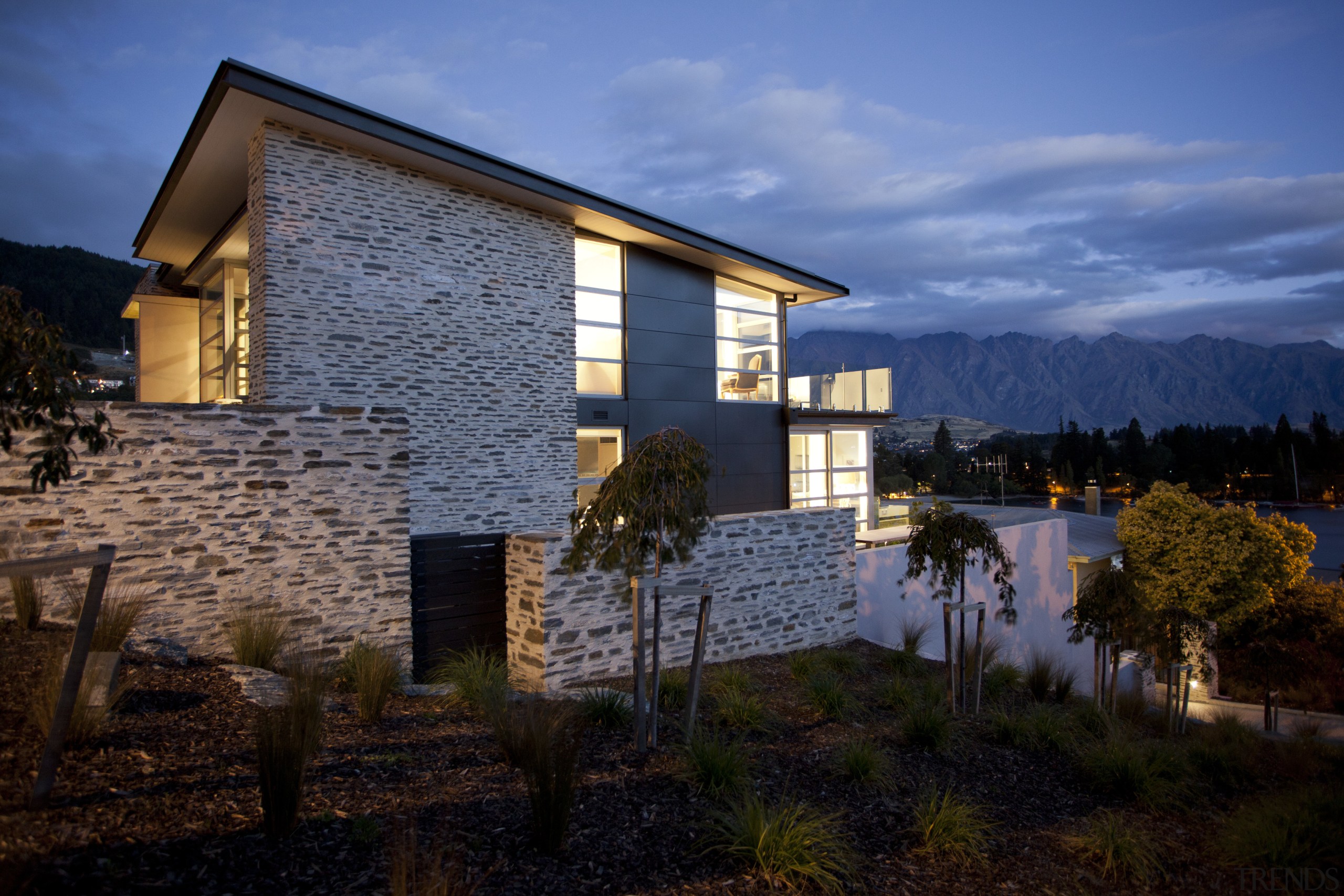 This home was designed by Allan Huntington of architecture, building, cloud, cottage, estate, evening, facade, home, house, landscape, lighting, mountain, property, real estate, reflection, residential area, sky, tree, window, black, blue