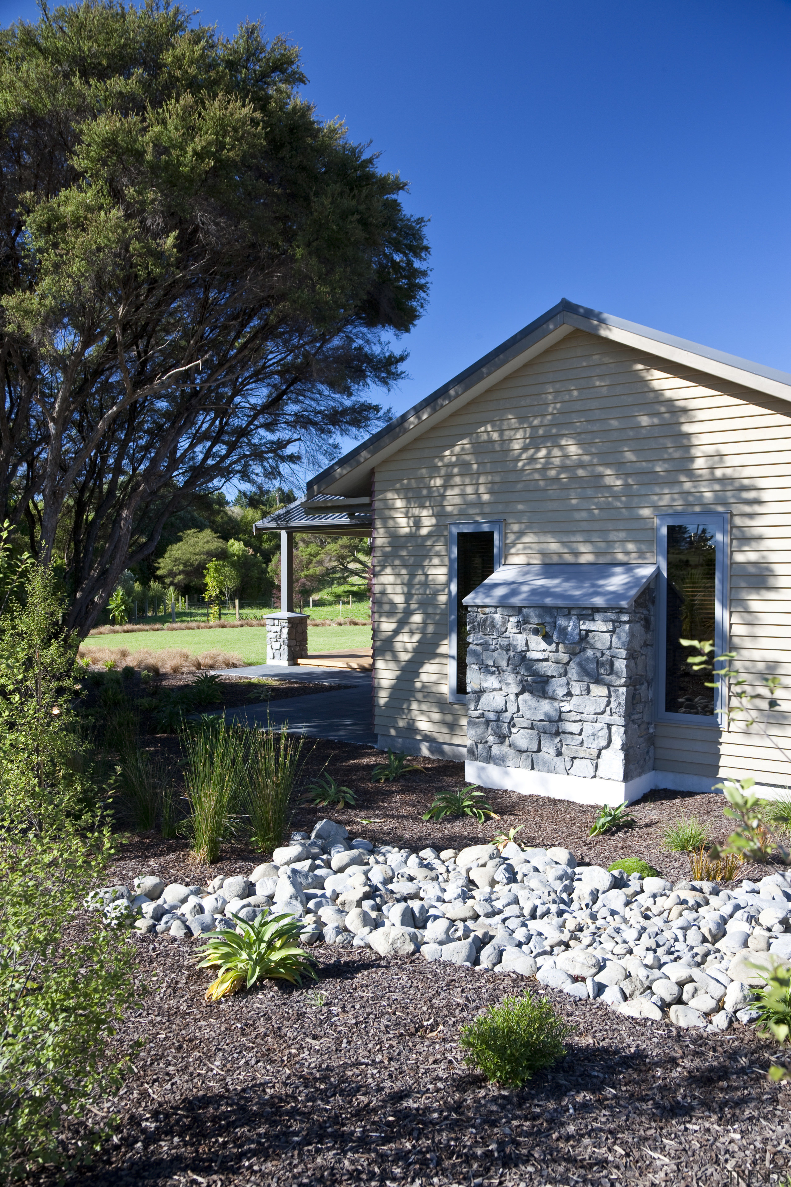 Exterior view of an energy-efficient home and gardens cottage, farmhouse, home, house, real estate, sky, tree, black