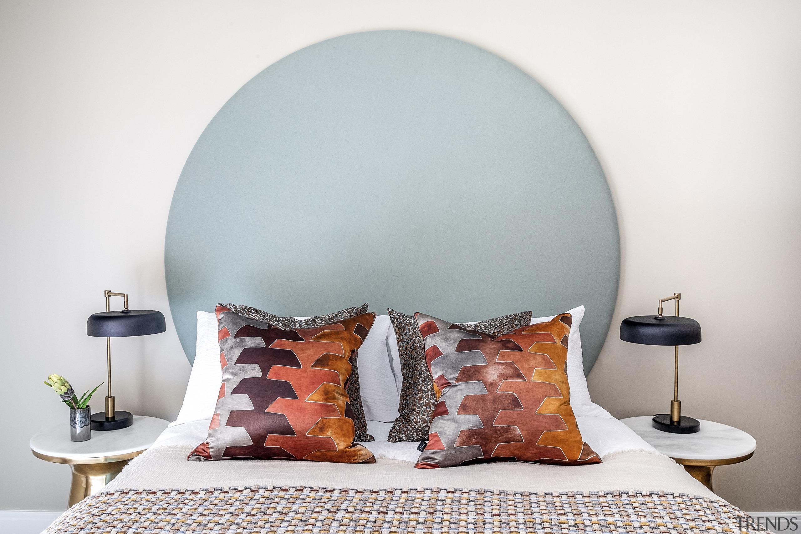 In another guest bedroom, a bespoke headboard is 