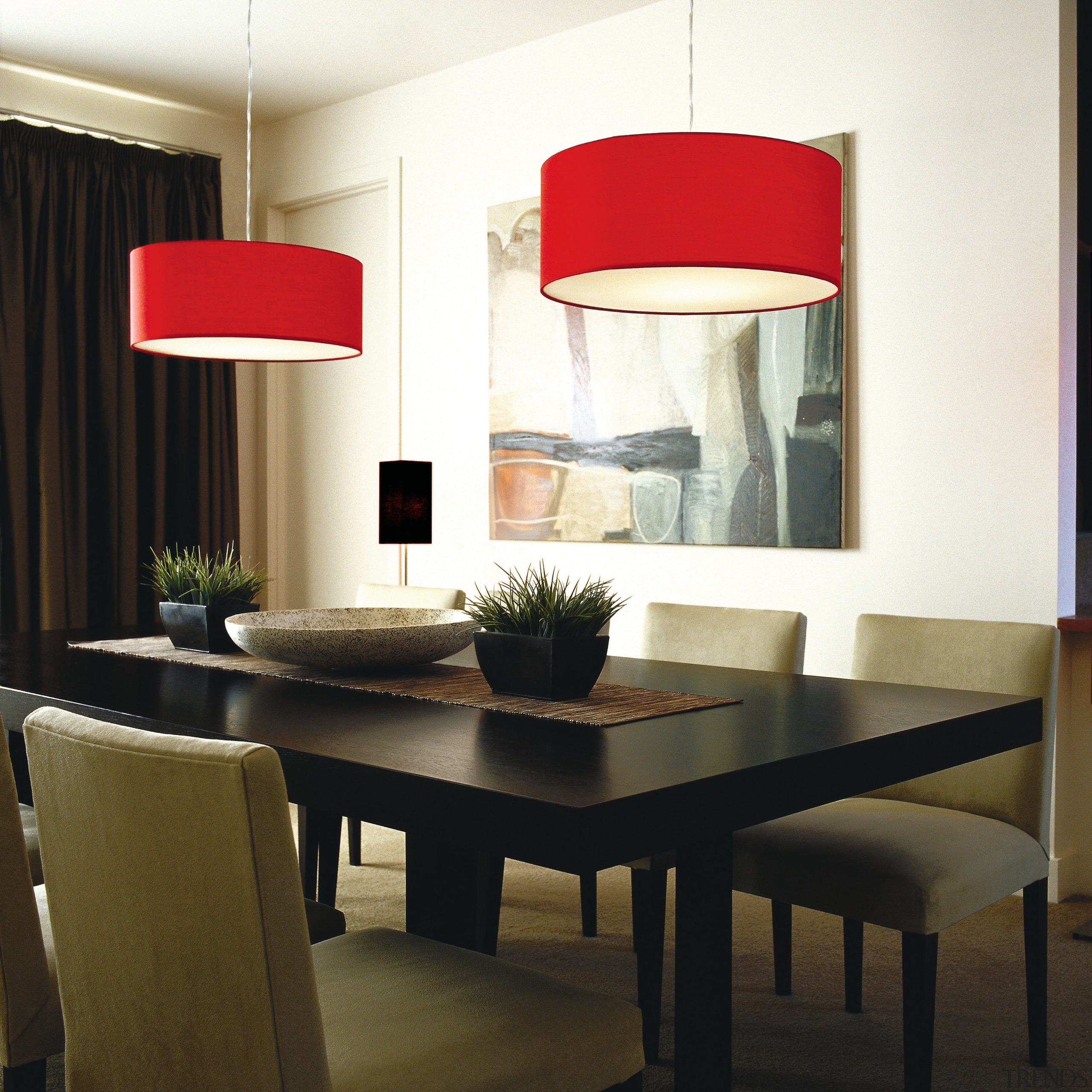 Dining room with two red lamp shades overhead. ceiling, chair, chandelier, dining room, furniture, interior design, lamp, light fixture, lighting, lighting accessory, product design, room, table, wall, window, white, black