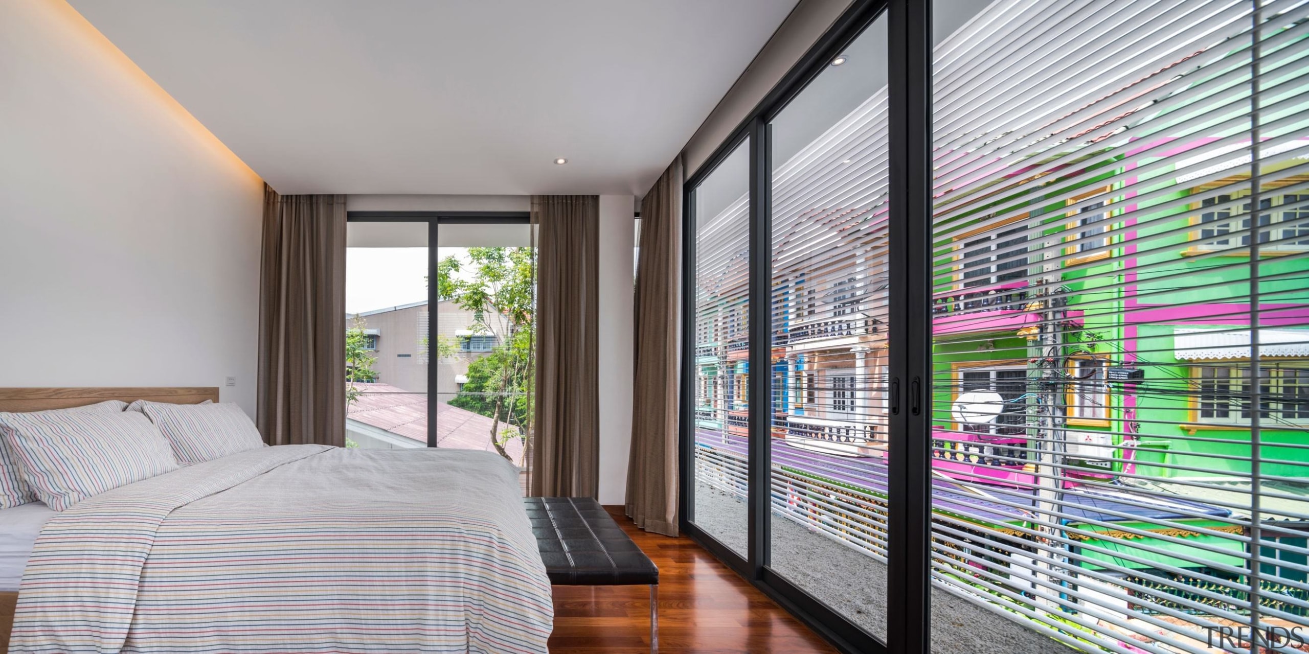 Colourful neighbourhood homes make for an interesting view architecture, bedroom, interior design, property, real estate, window, window covering, gray