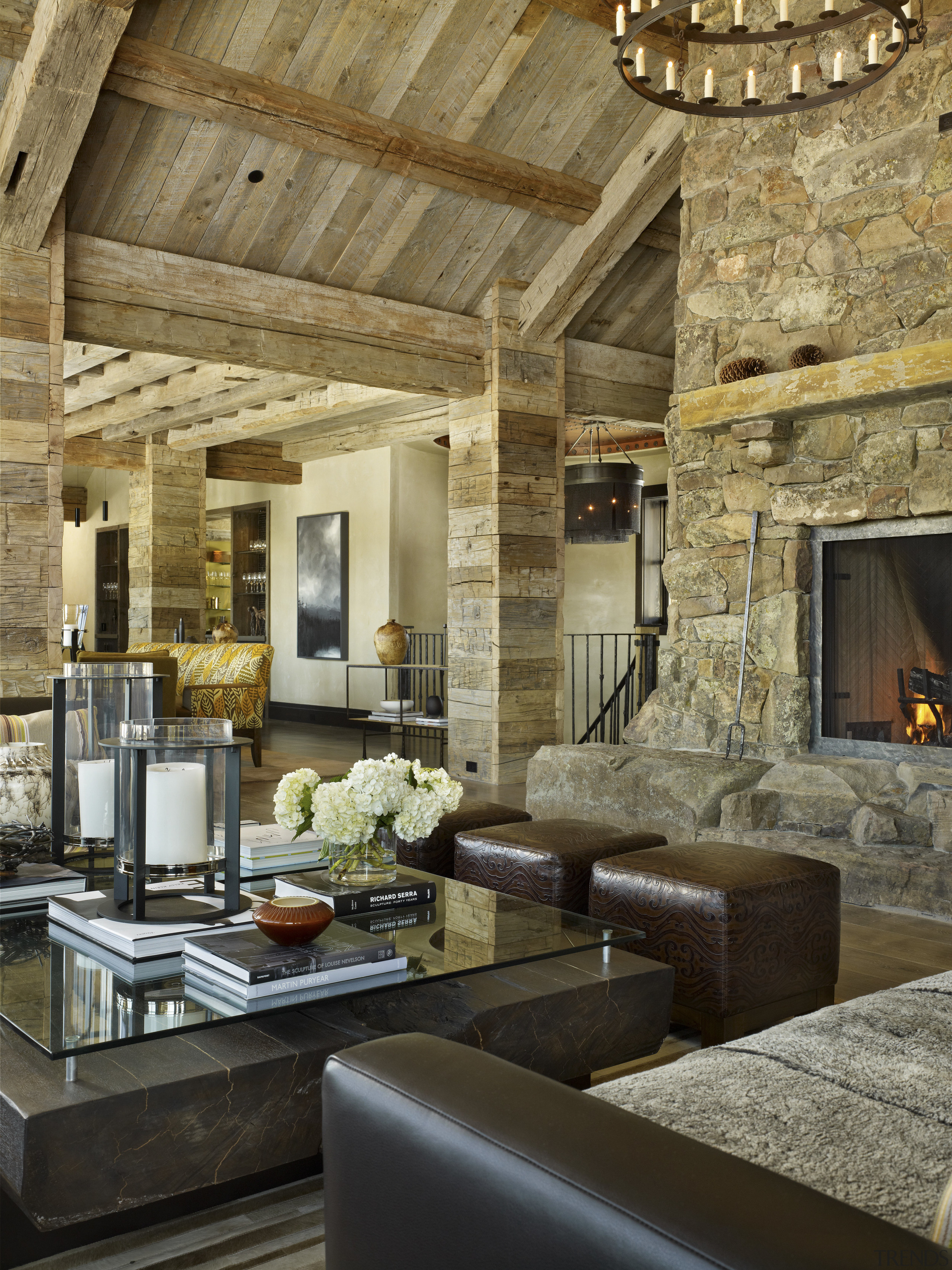 Rustic surfaces are underpinned with contemporary touches in beam, ceiling, fireplace, interior design, living room, brown