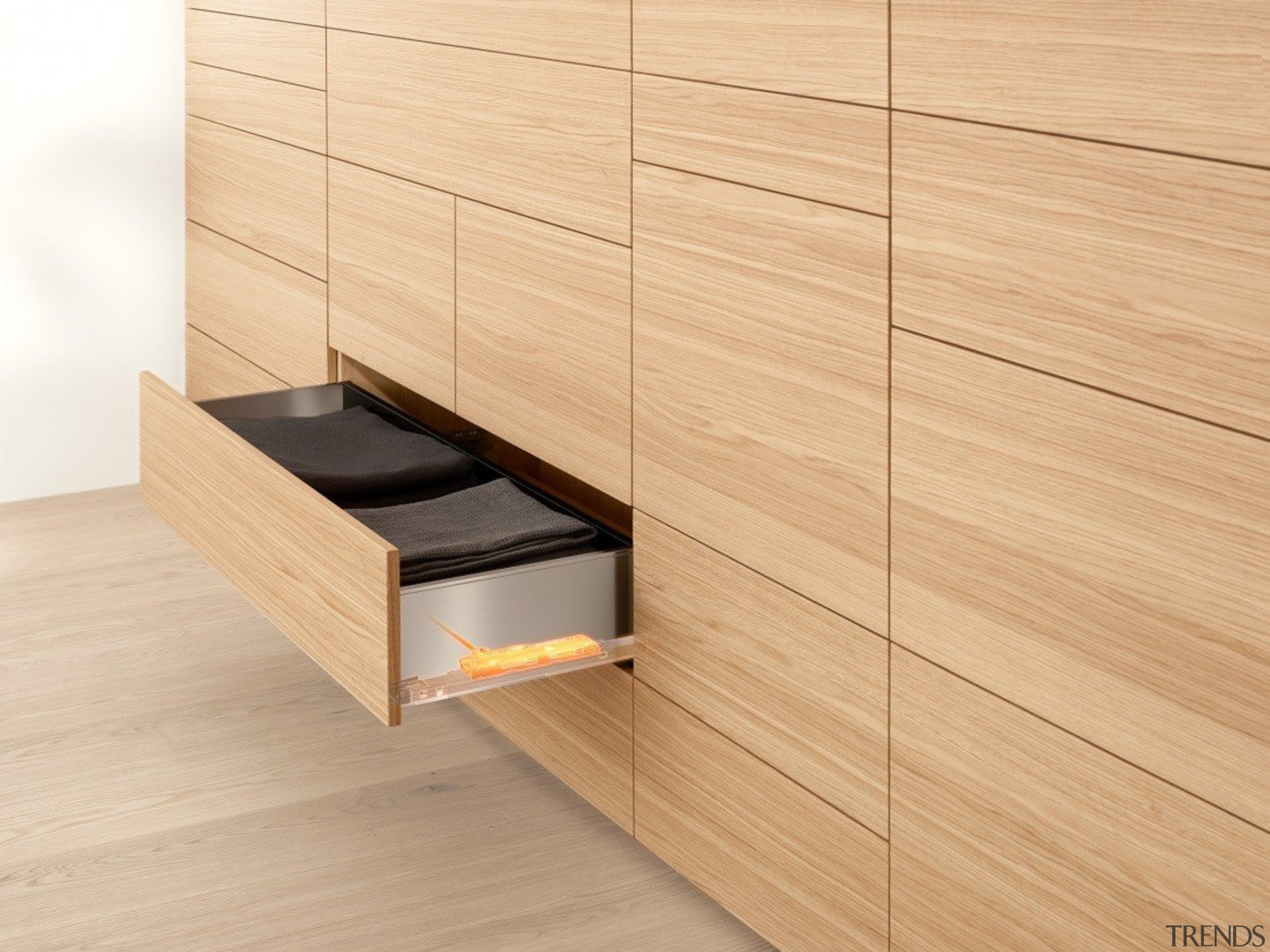 134 One topic. Three applications. Four motion technologies.Infinite cabinetry, chest of drawers, drawer, floor, flooring, furniture, hardwood, laminate flooring, plywood, product, product design, sideboard, tile, wall, wood, wood flooring, wood stain, orange