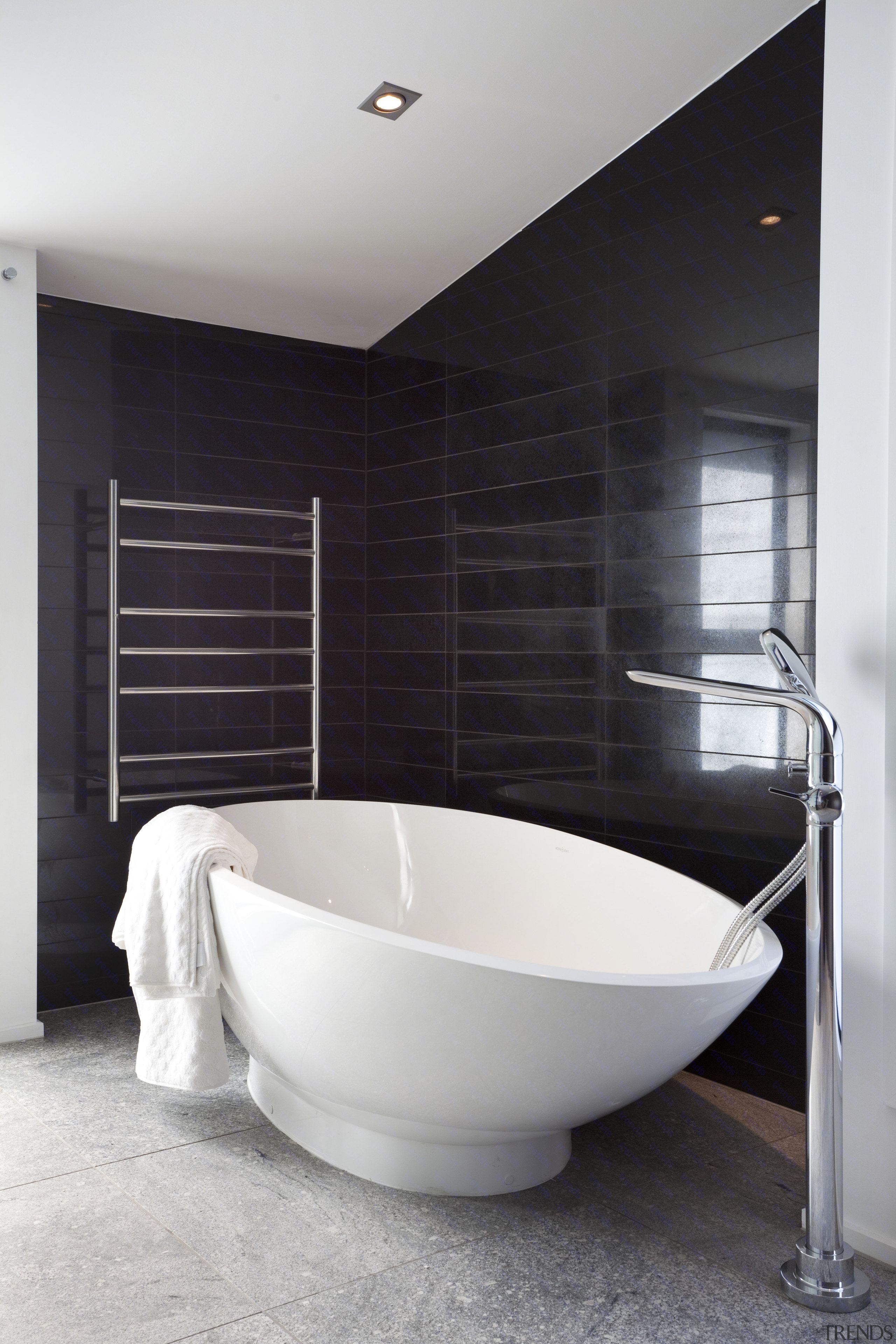 View Of Bathroom With Black Tiled Walls And Contemporary Oval View Of Bathroom With Black Tiled Walls And Contemporary Oval