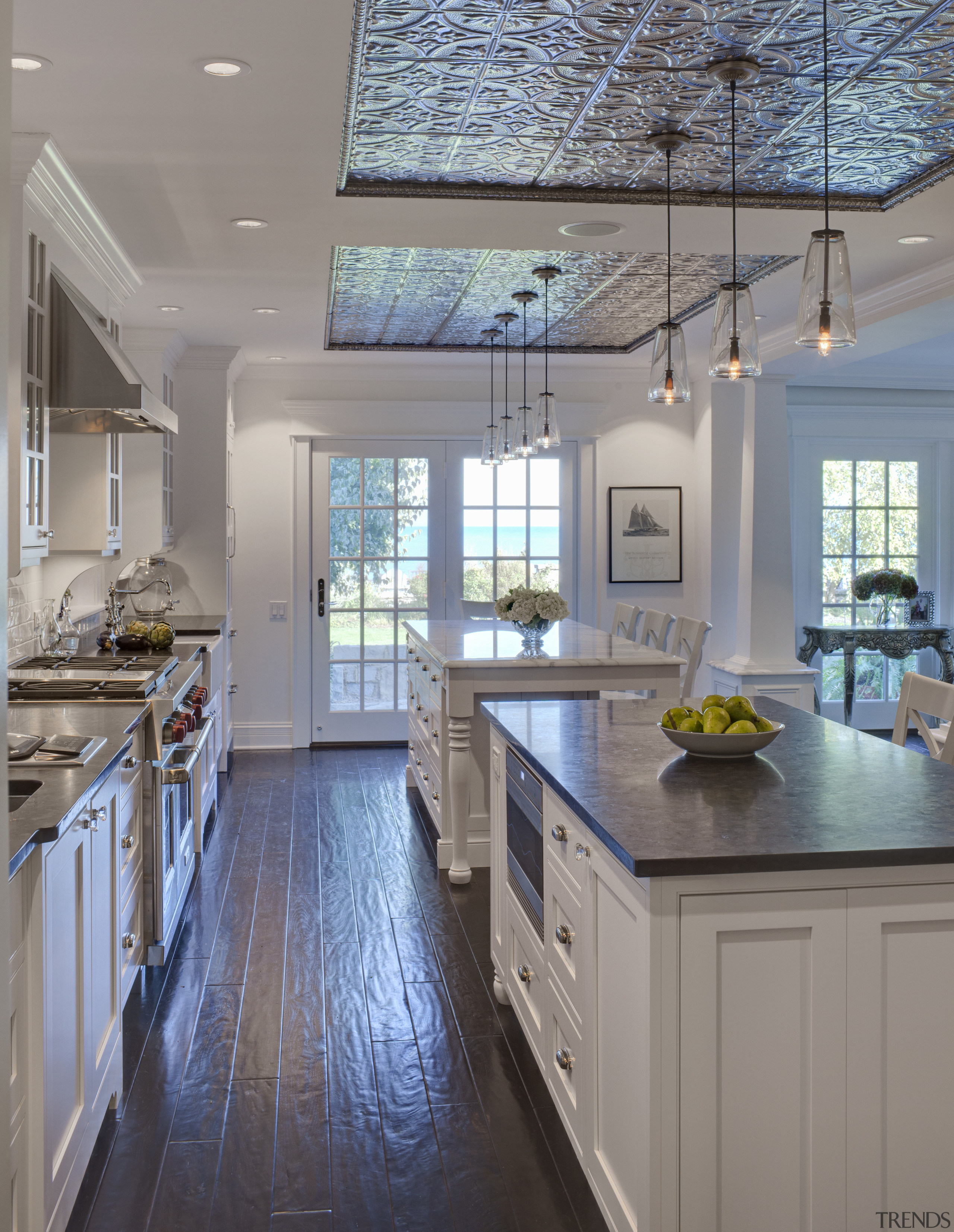 View of kitchen in 1950's remodelled lakefront home cabinetry, ceiling, countertop, cuisine classique, daylighting, floor, flooring, home, interior design, kitchen, real estate, room, window, wood flooring, gray