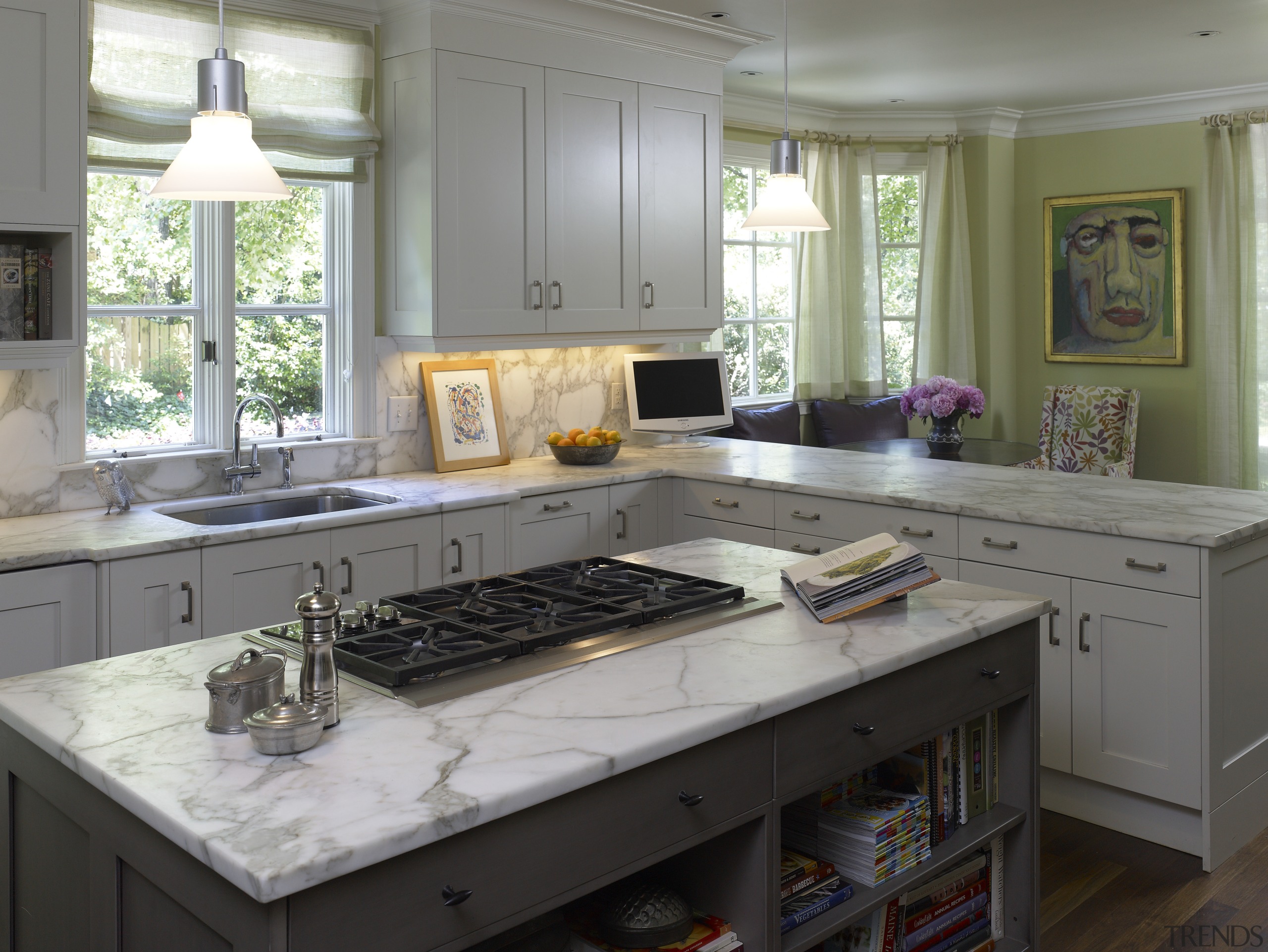 Interior view of the kitchen. Features kitchen island cabinetry, countertop, cuisine classique, kitchen, room, gray