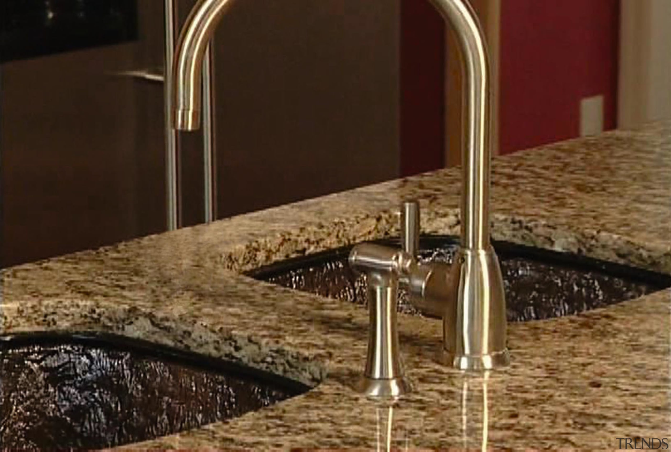 A view of this kitchen featuring a JSG countertop, plumbing fixture, sink, tap, brown