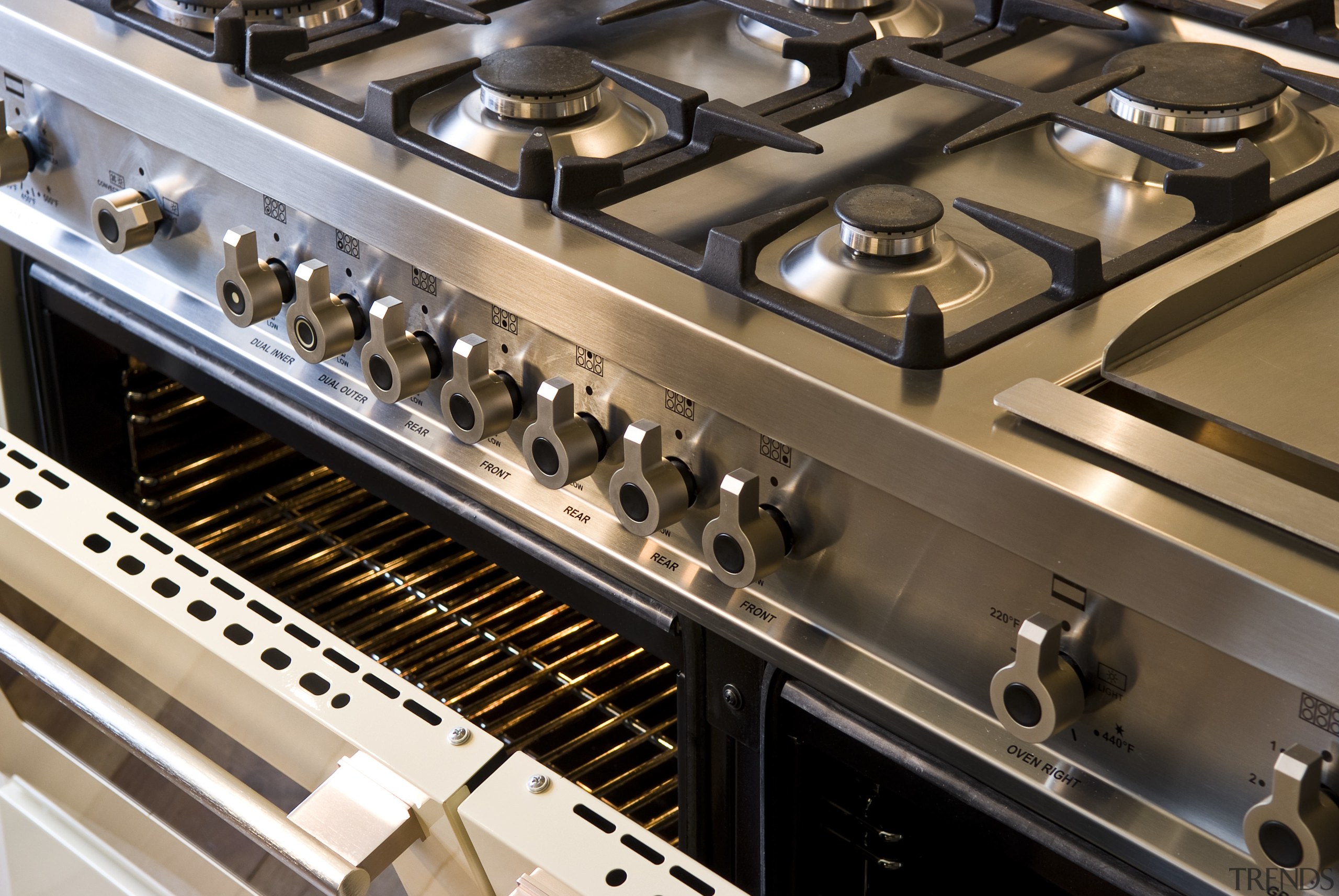 View of a traditional-styled kitchen which features stainless audio equipment, electronic instrument, electronics, musical instrument accessory, brown, black