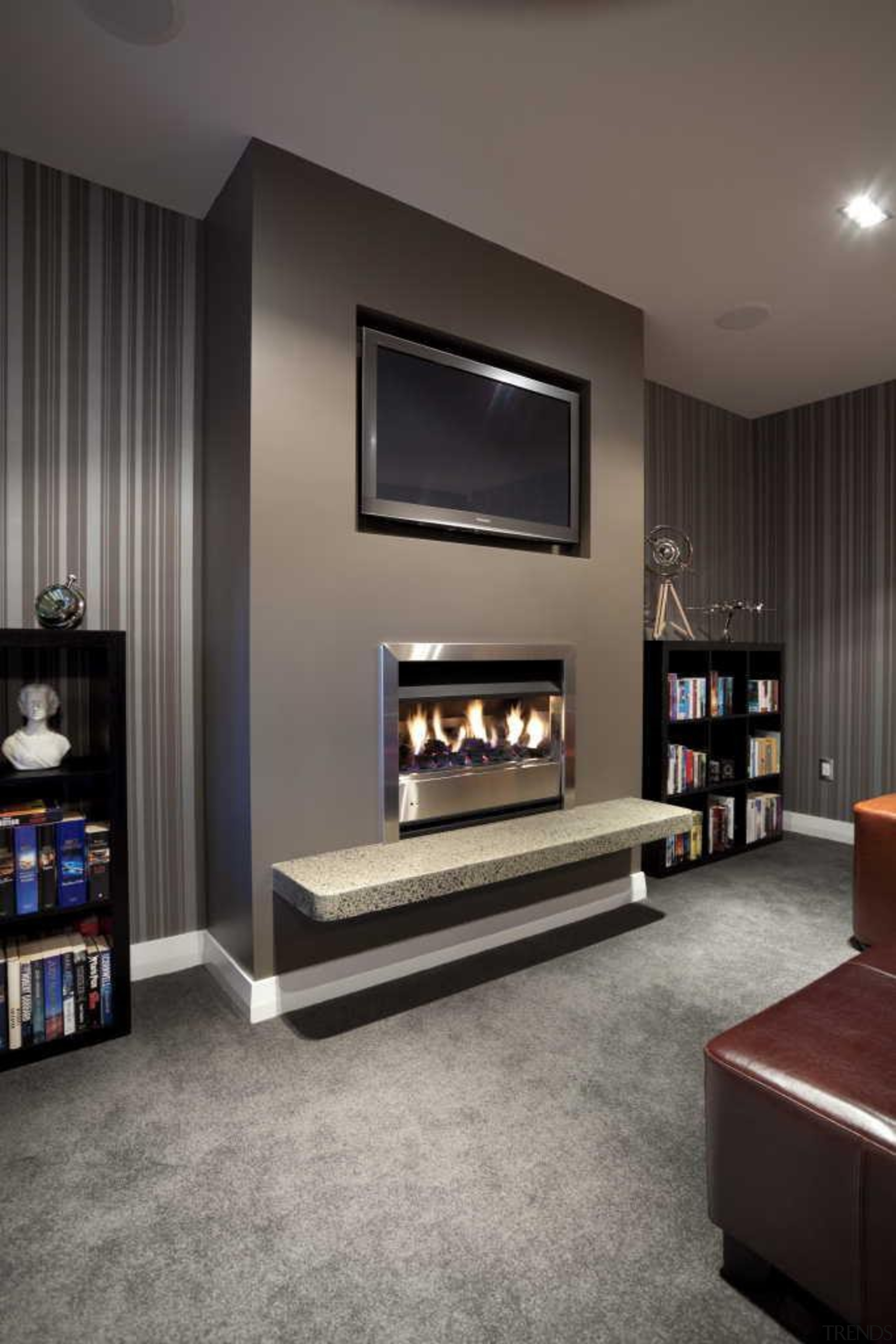 tv screen above fireplace in dark wallpapered room fireplace, floor, flooring, furniture, hearth, interior design, living room, room, wall, gray, black