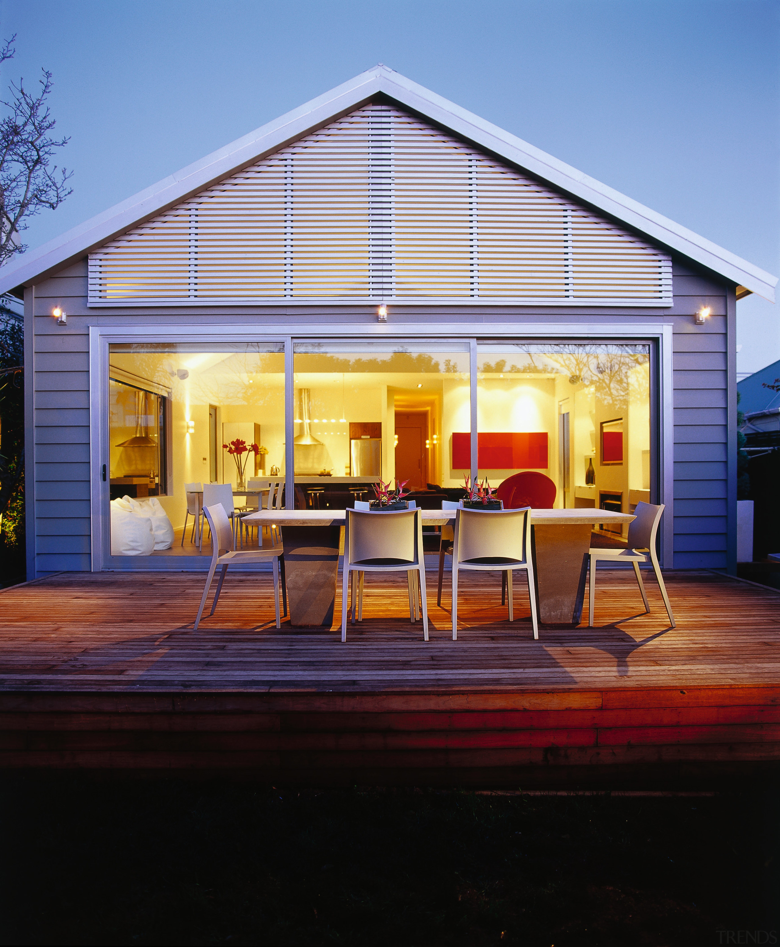 Rear deck of house with outdoor dining furniture, home, house, lighting, outdoor structure, real estate, window, teal, black