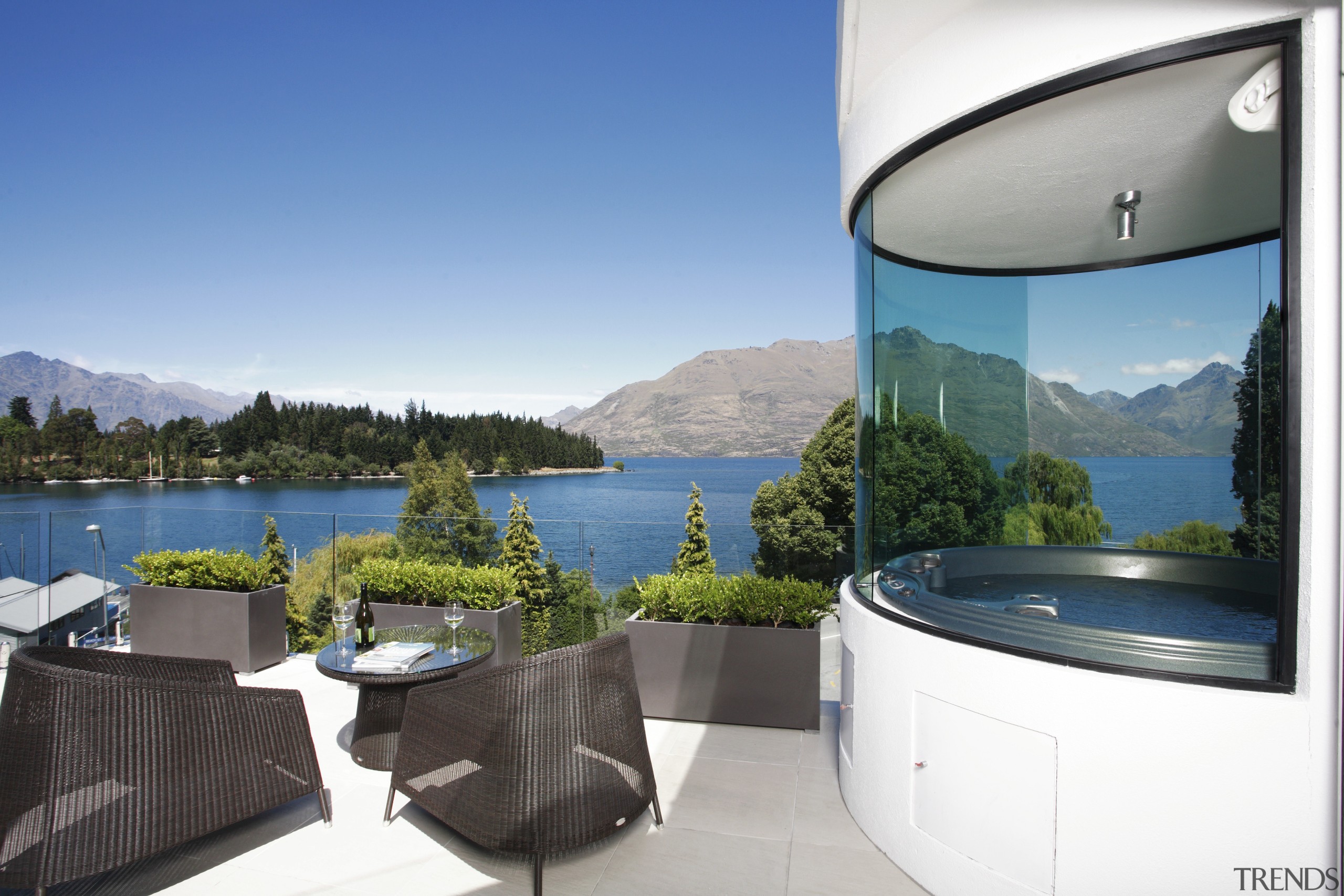 Exterior view of an apartment building which features apartment, estate, home, house, interior design, property, real estate, swimming pool, villa, water, white, teal