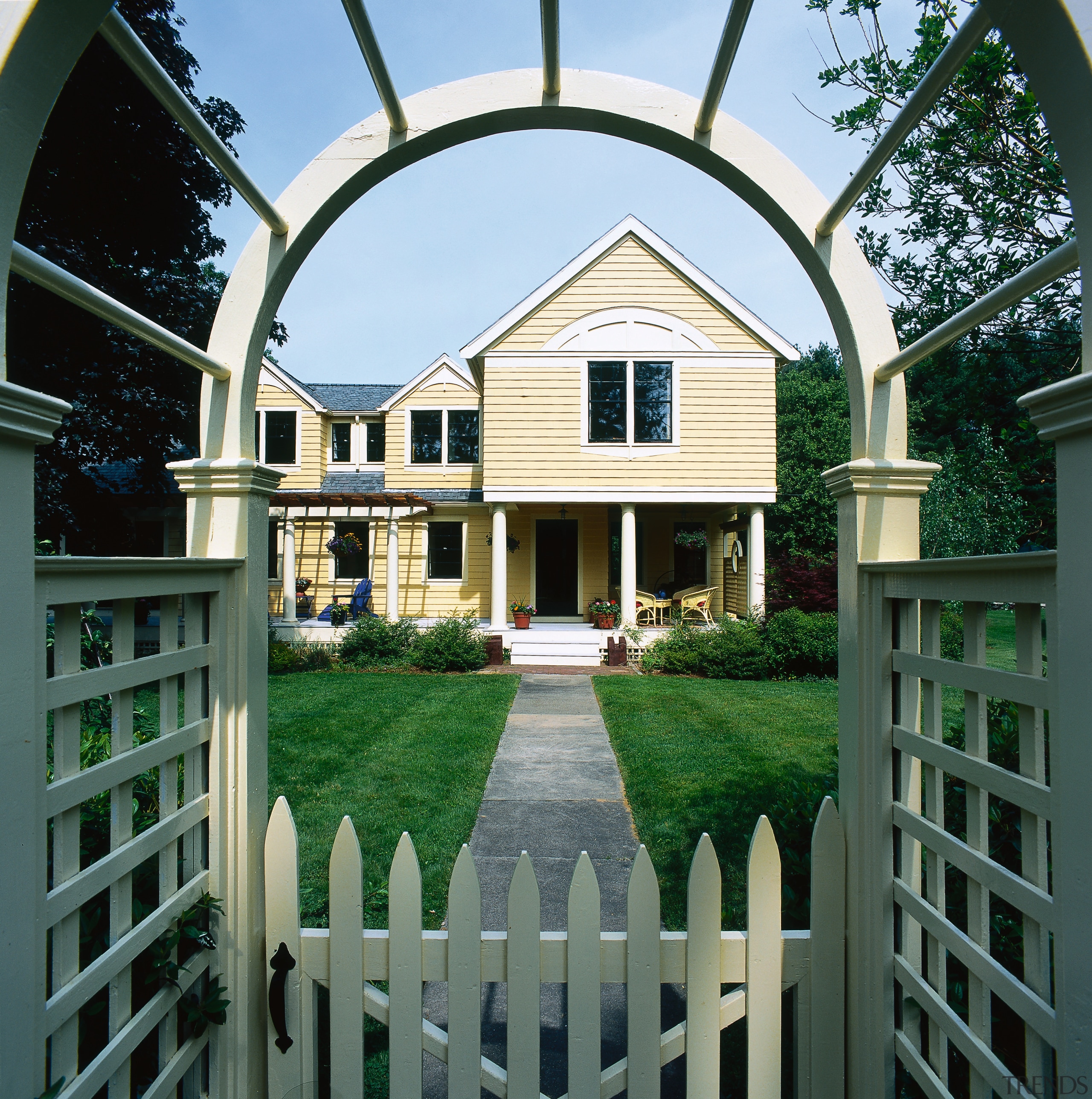 View of the entrance to garden and house, building, cottage, estate, facade, fence, home, home fencing, house, lawn, mansion, outdoor structure, property, real estate, residential area, siding, window