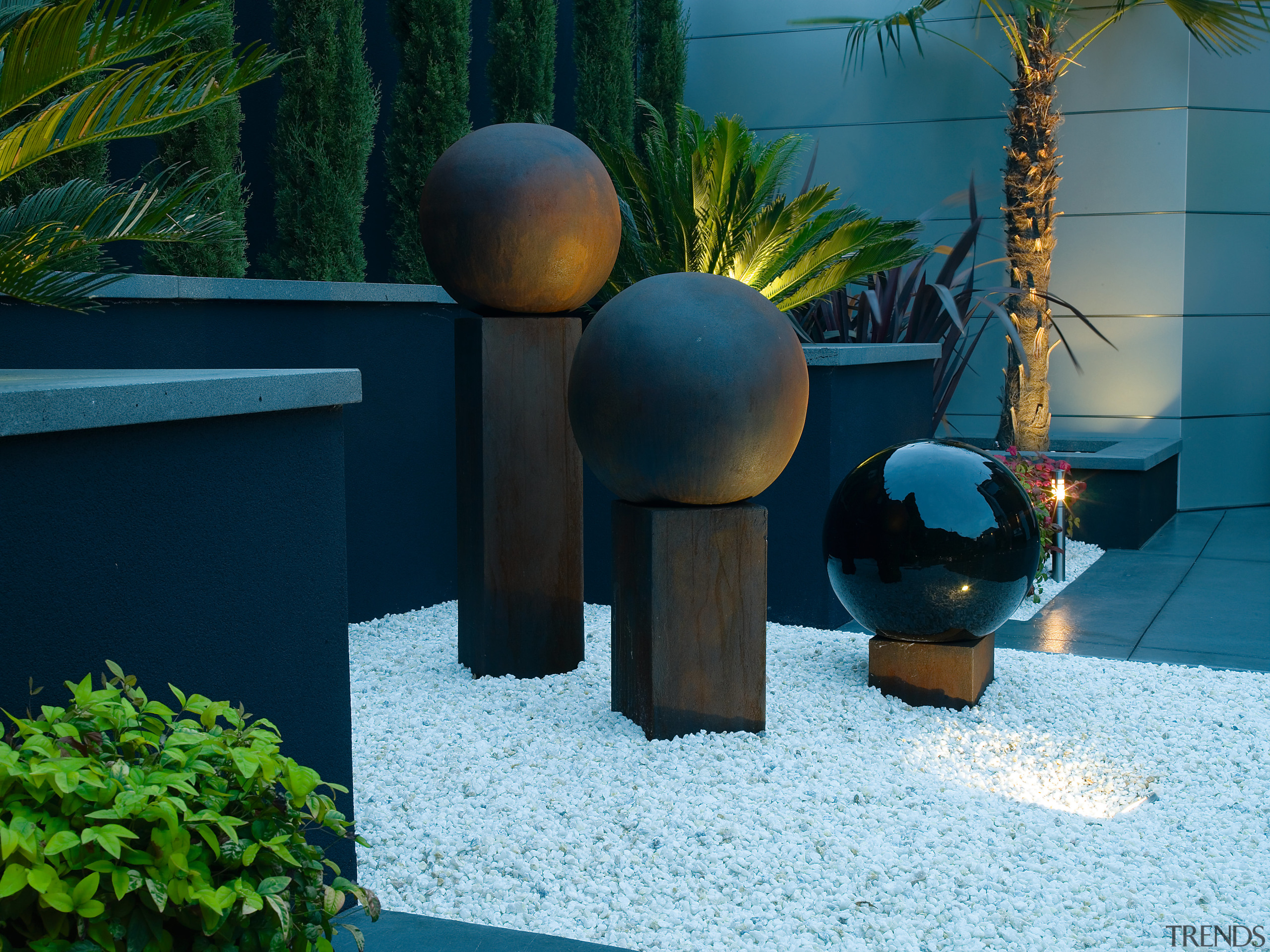 view of the ball sculptures sitting on the biome, garden, grass, lighting, majorelle blue, plant, yard, teal