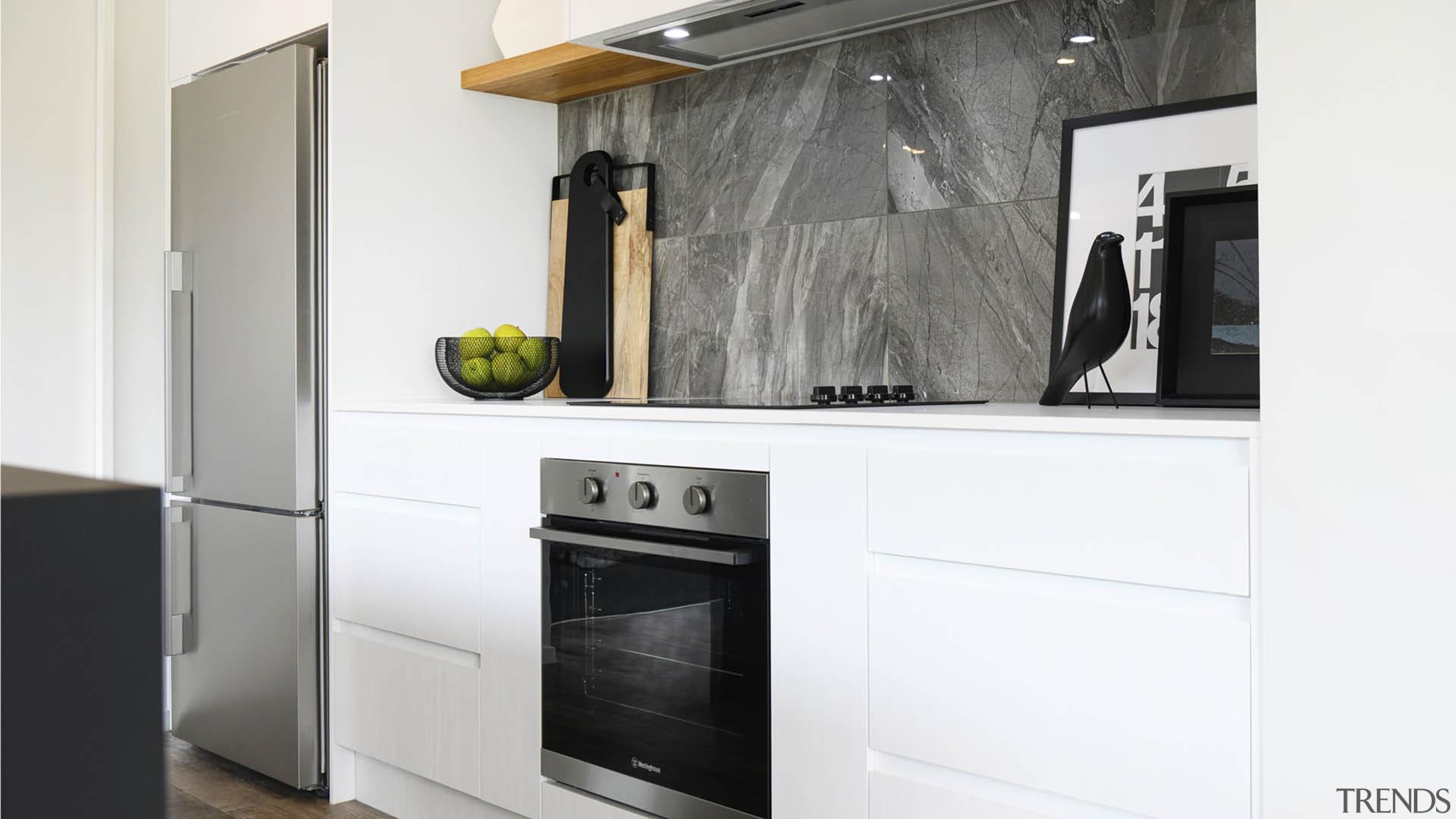 The kitchen's stone splashback is a stand-out luxurious 