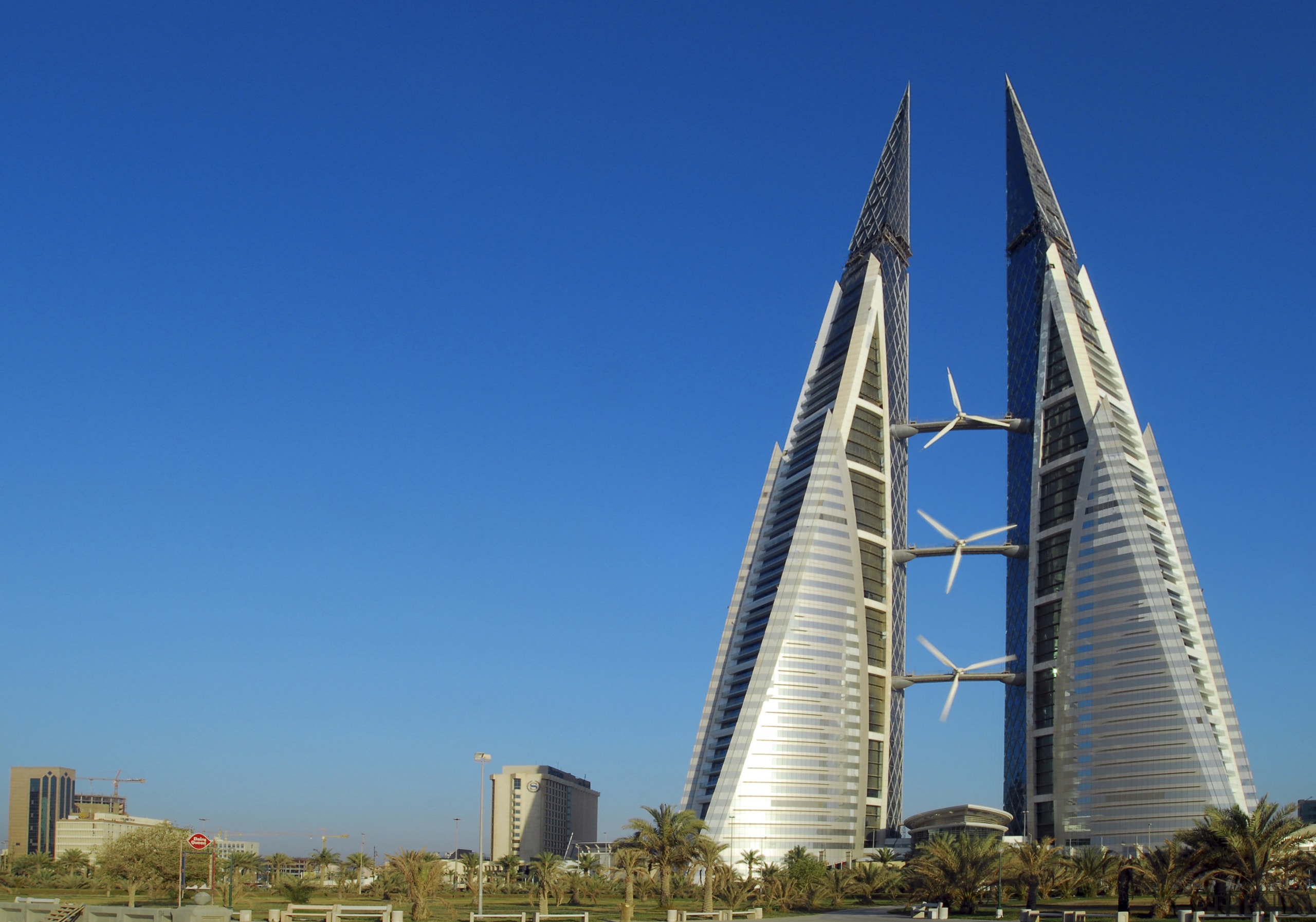 The new Bahrain world Trade Centre meets up architecture, building, city, corporate headquarters, daytime, landmark, metropolis, metropolitan area, mixed use, sky, skyline, skyscraper, tower, tower block, blue