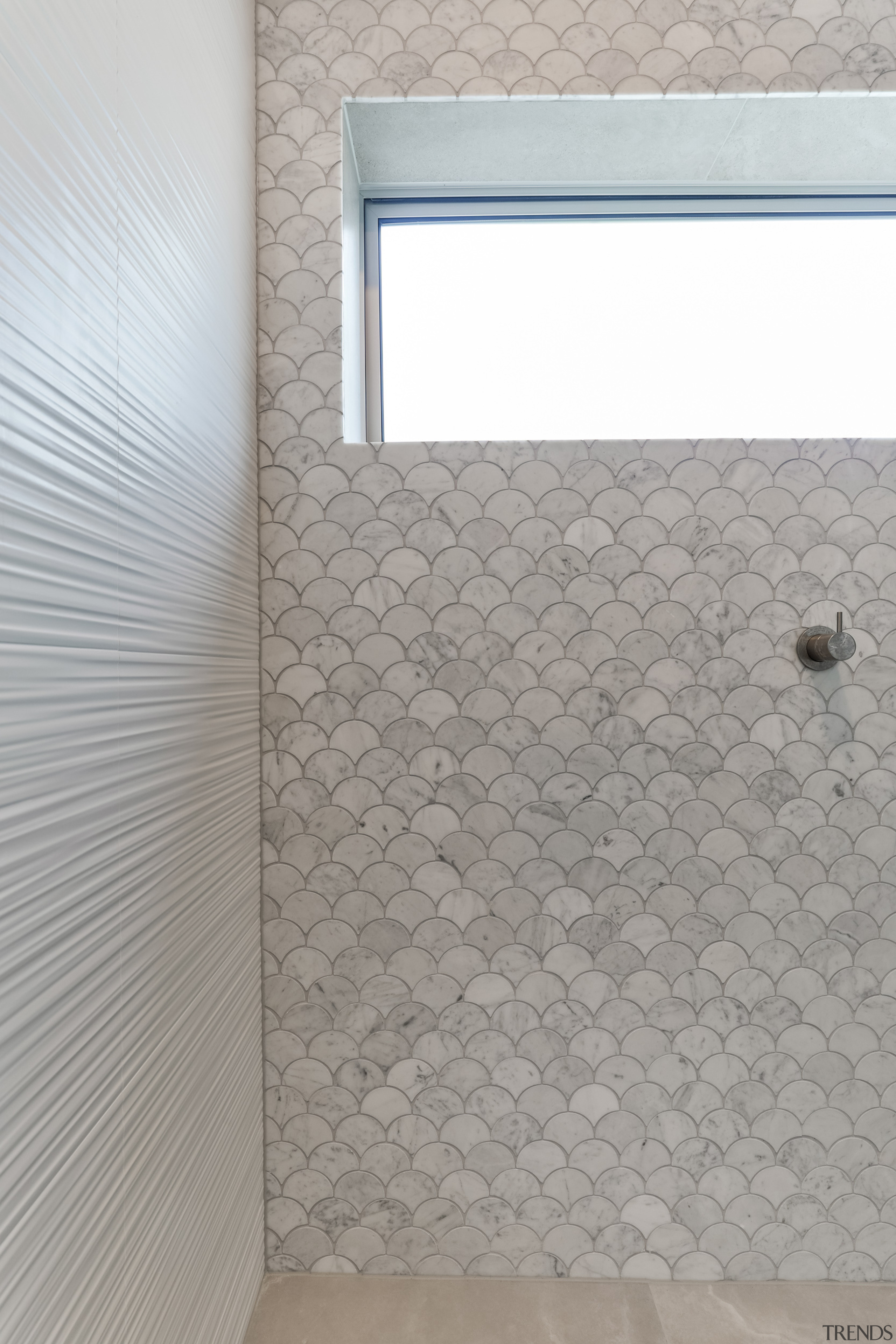 The Fish Scale mosaics cut from honed Carrara 