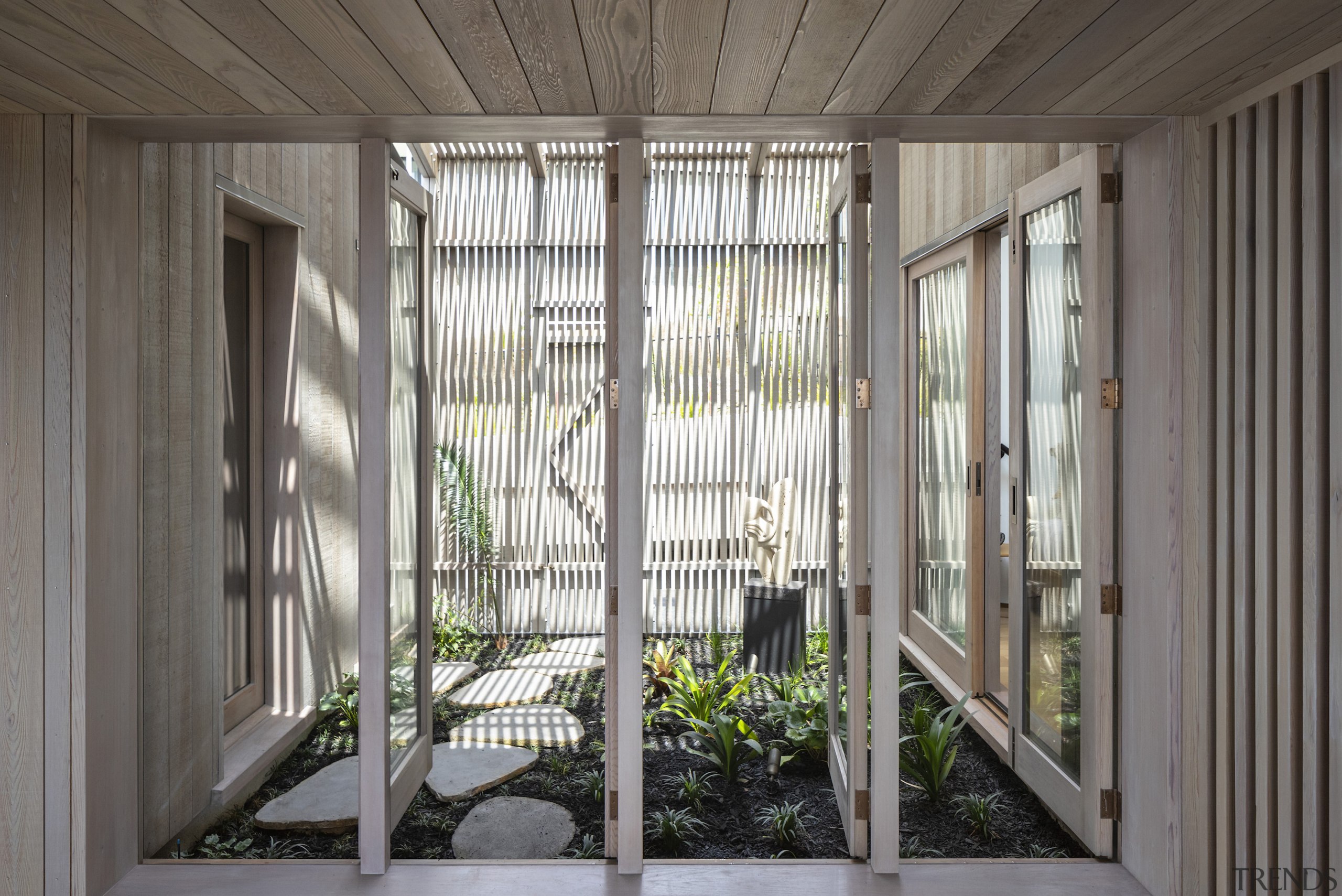 The home's sheltered indoor garden separates the master 