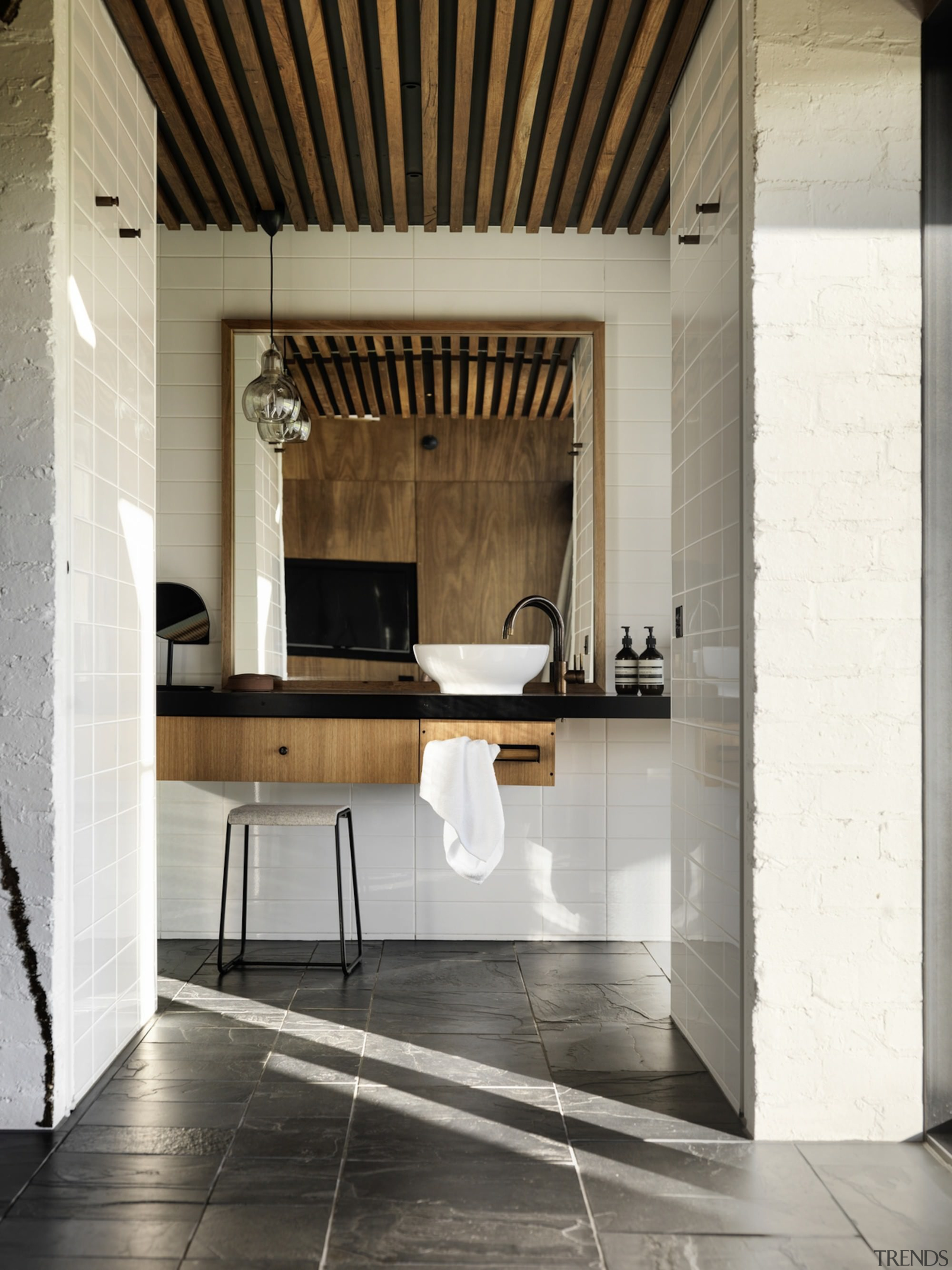 This bathroom features a floating vanity and large architecture, floor, flooring, furniture, interior design, table, white