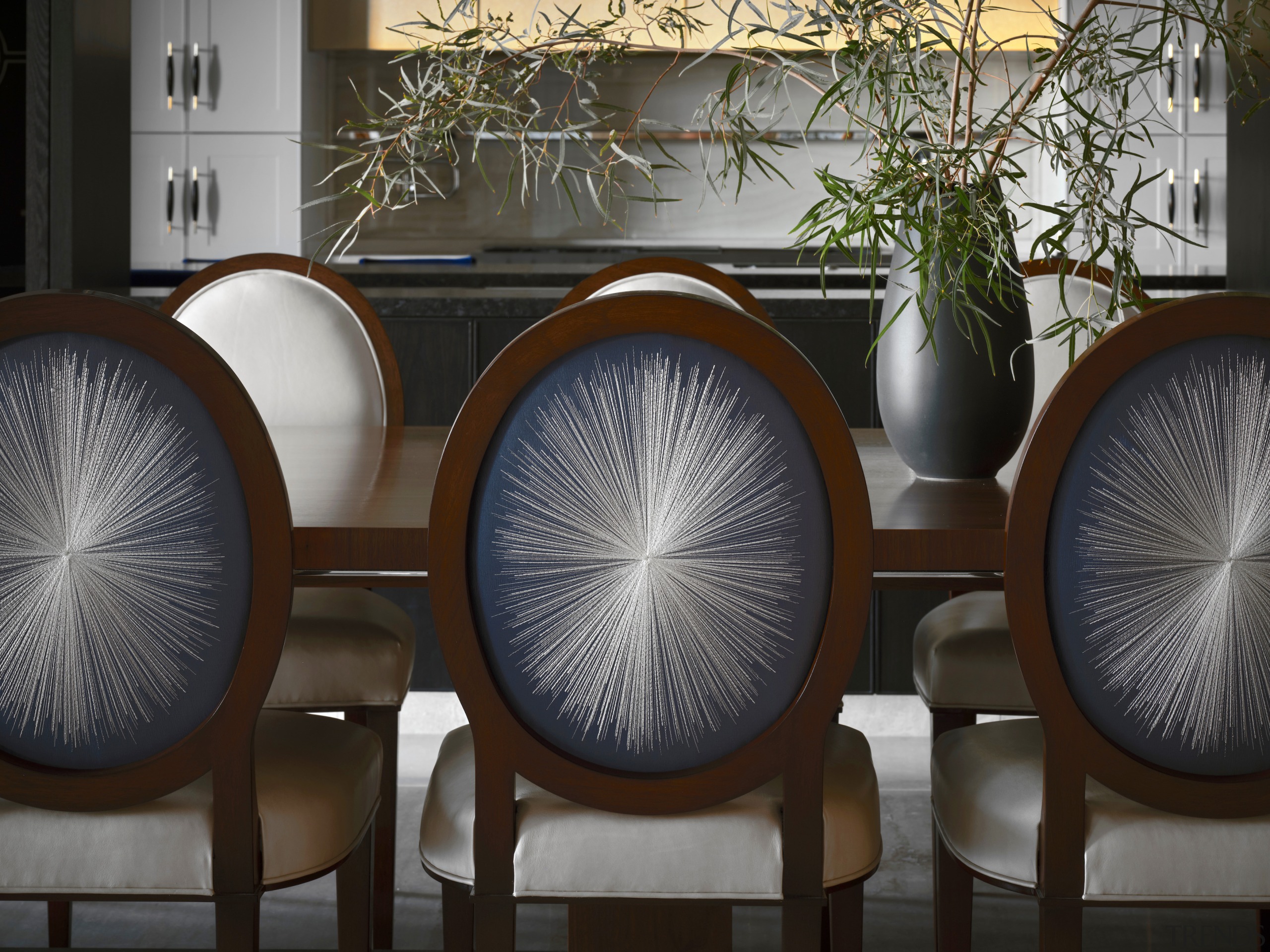 The main dining room chairs feature a hand-embroidered 