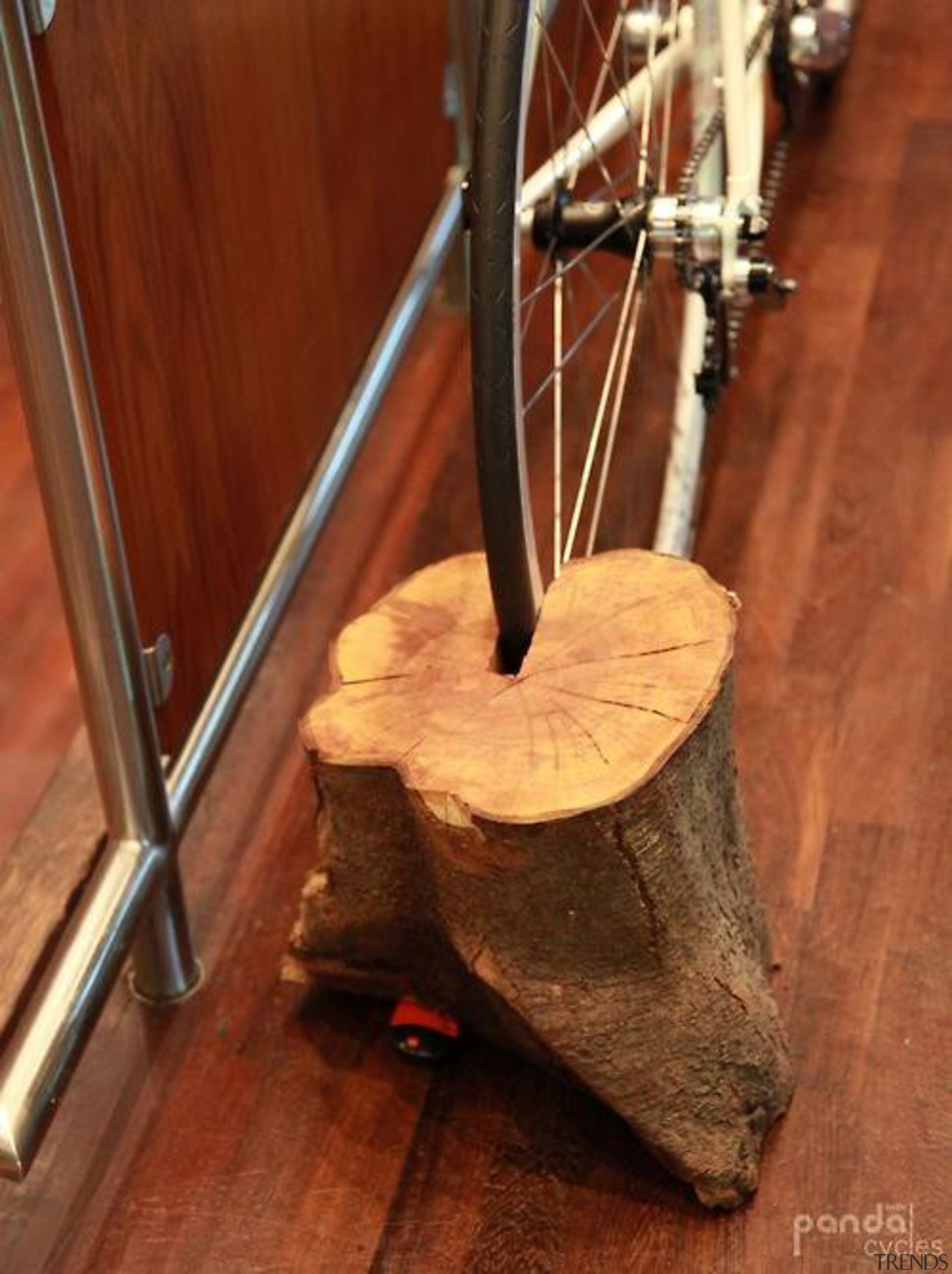 Sustainable bicycle storage solution. So simple but such flooring, musical instrument, wood, brown, red